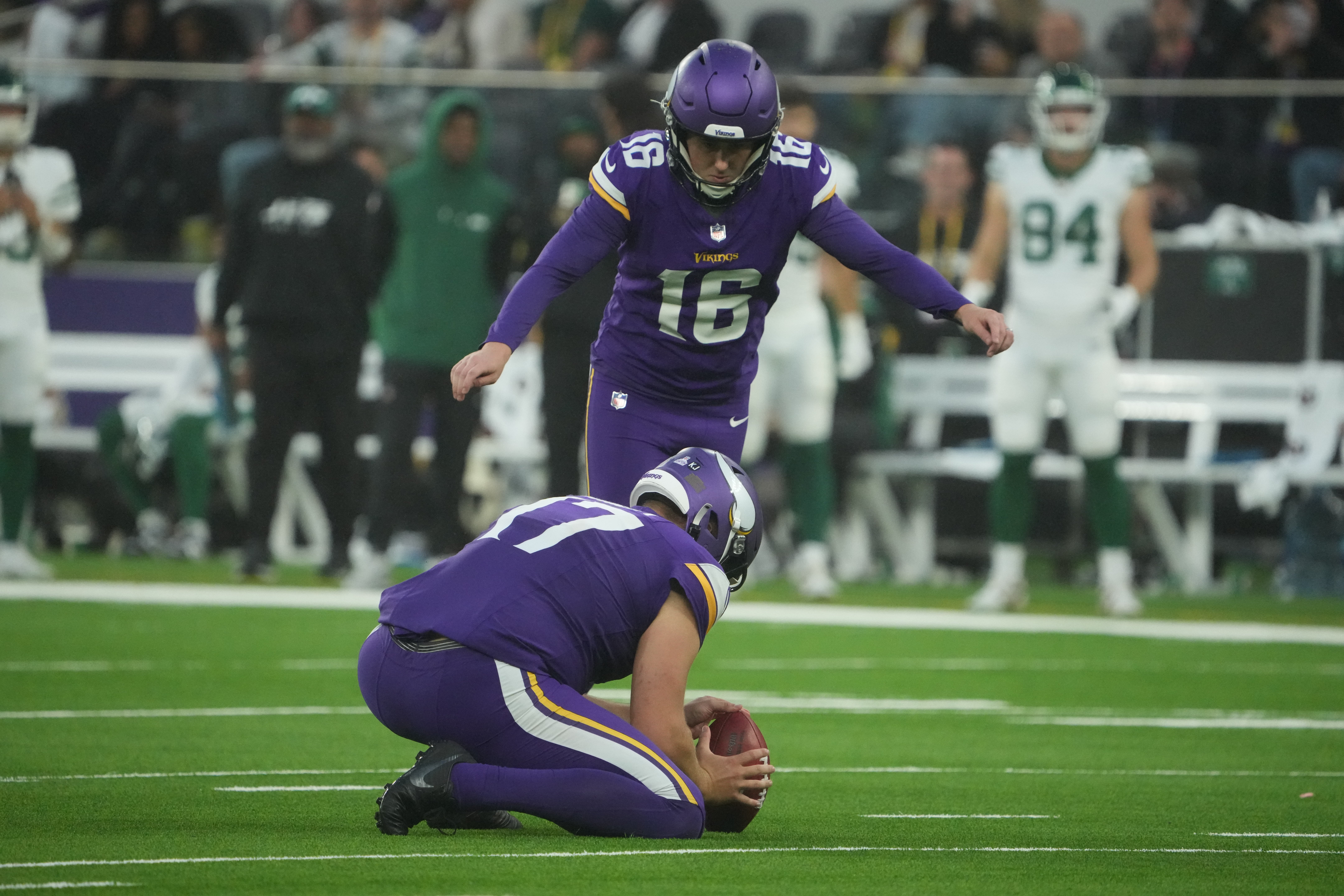 Oct 6, 2024; London, United Kingdom; Minnesota Vikings place kicker Will Reichard (16) kicks a 41-yard field goal out of the hold of punter Ryan Wright (17) in the fourth quarter against the New York Jets at Tottenham Hotspur Stadium.