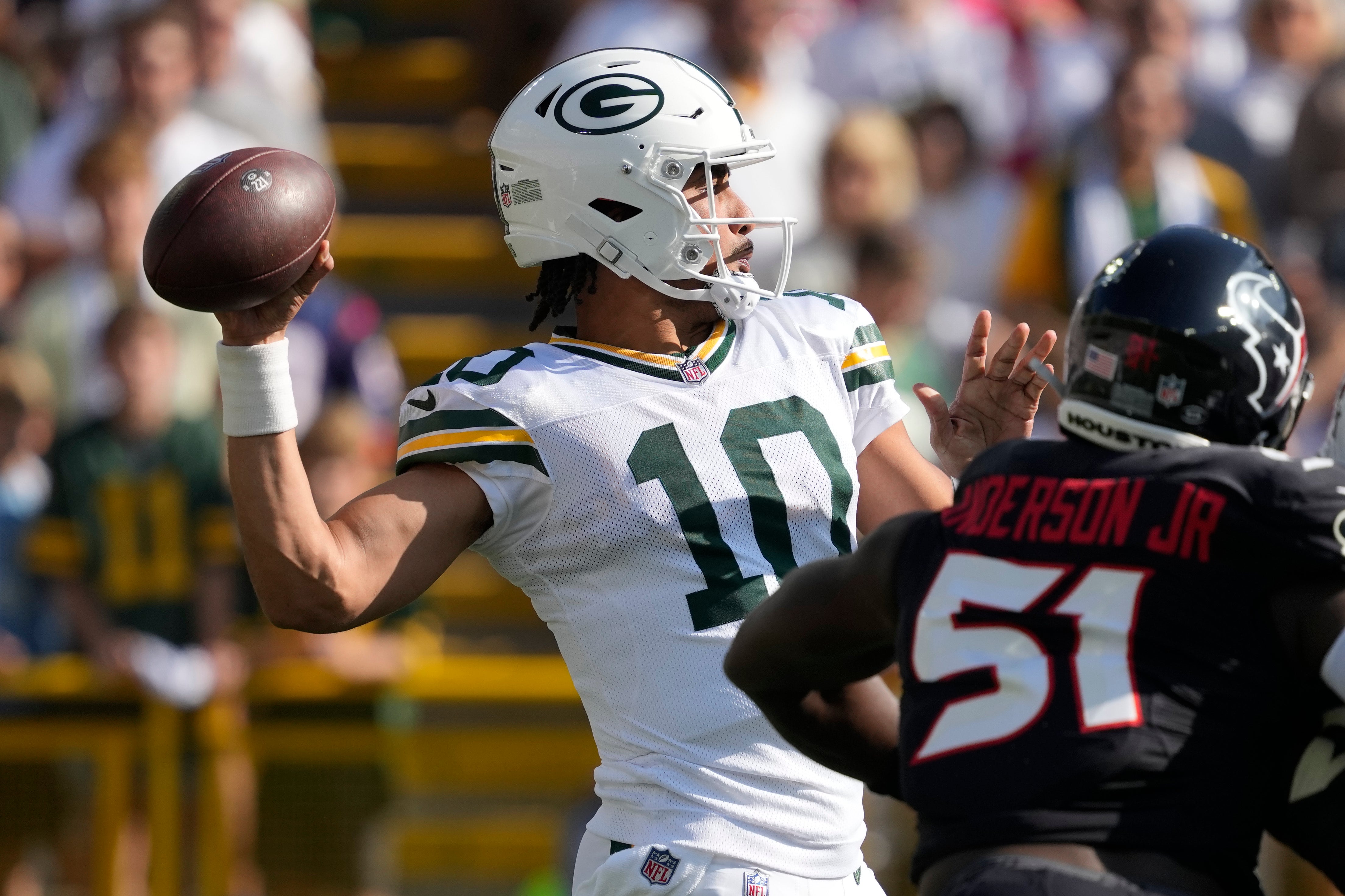 Green Bay Packers quarterback Jordan Love (10) throws a pass during the first quarter against the Houston Texans at Lambeau Field.