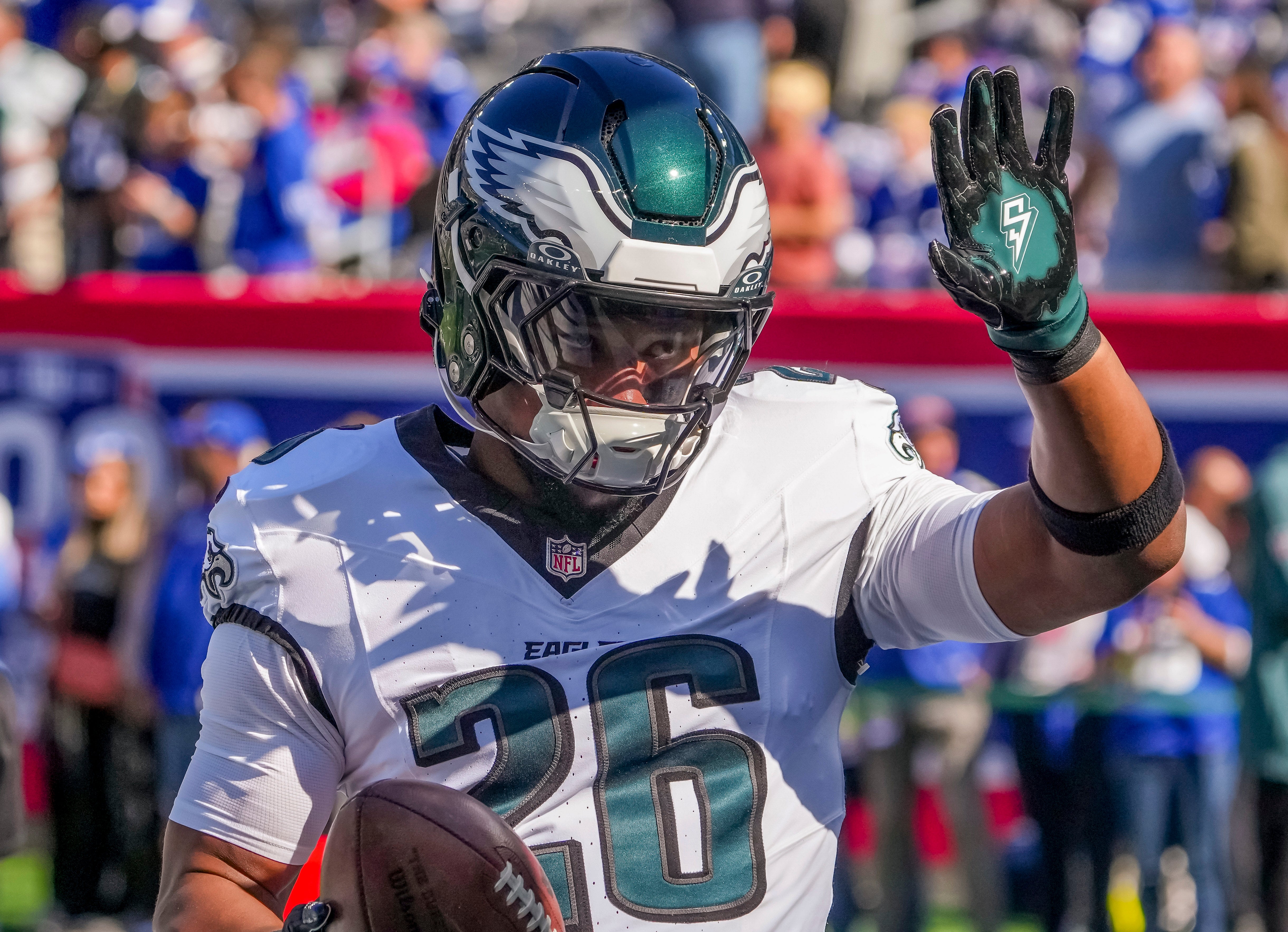 Philadelphia Eagles running back (and former NY Giants back) Saquon Barkley (26) greets fans at MetLife Stadium.