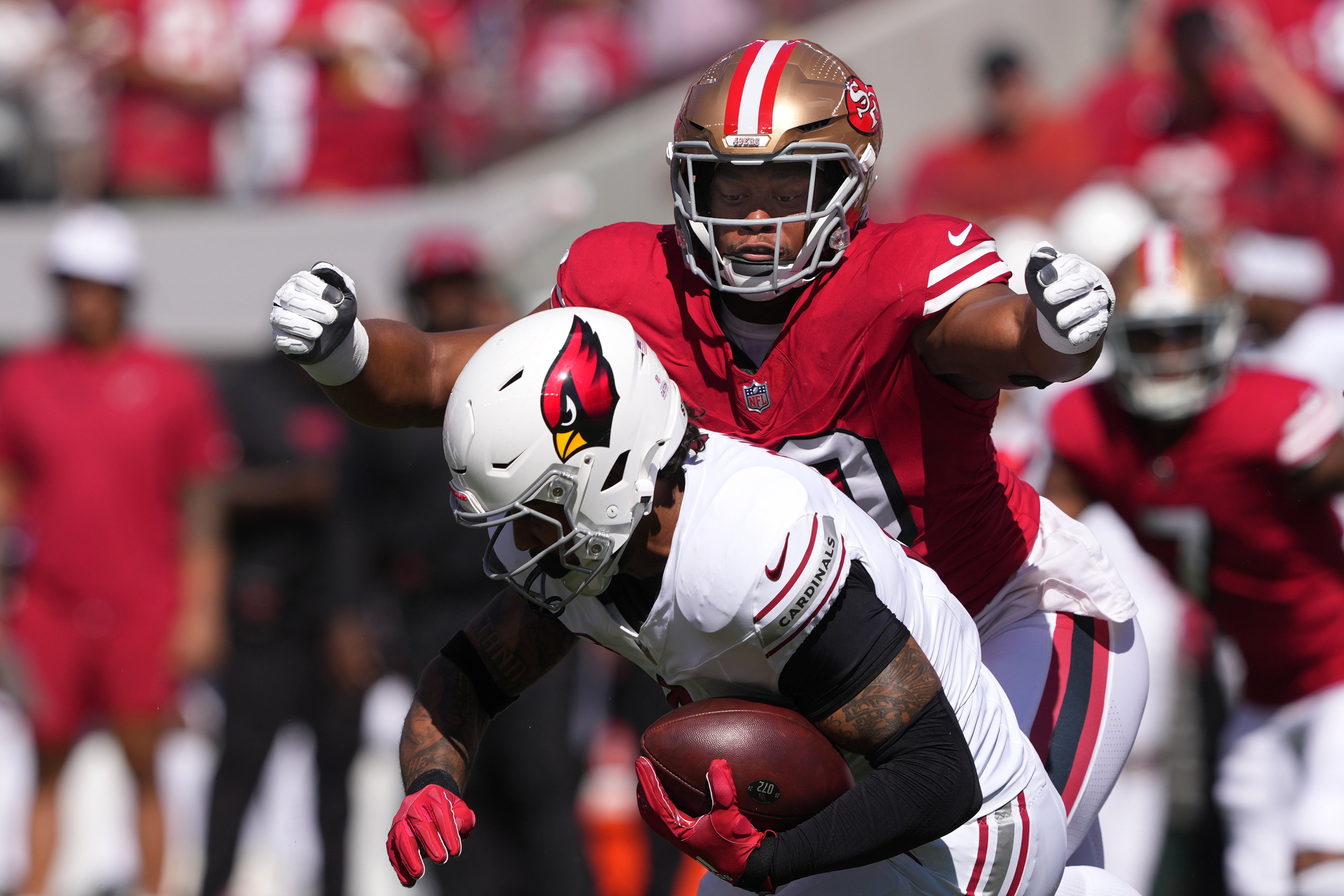 San Francisco 49ers defensive tackle Kevin Givens (back) tackles Arizona Cardinals running back James Conner (front) during the first quarter at Levi's Stadium.