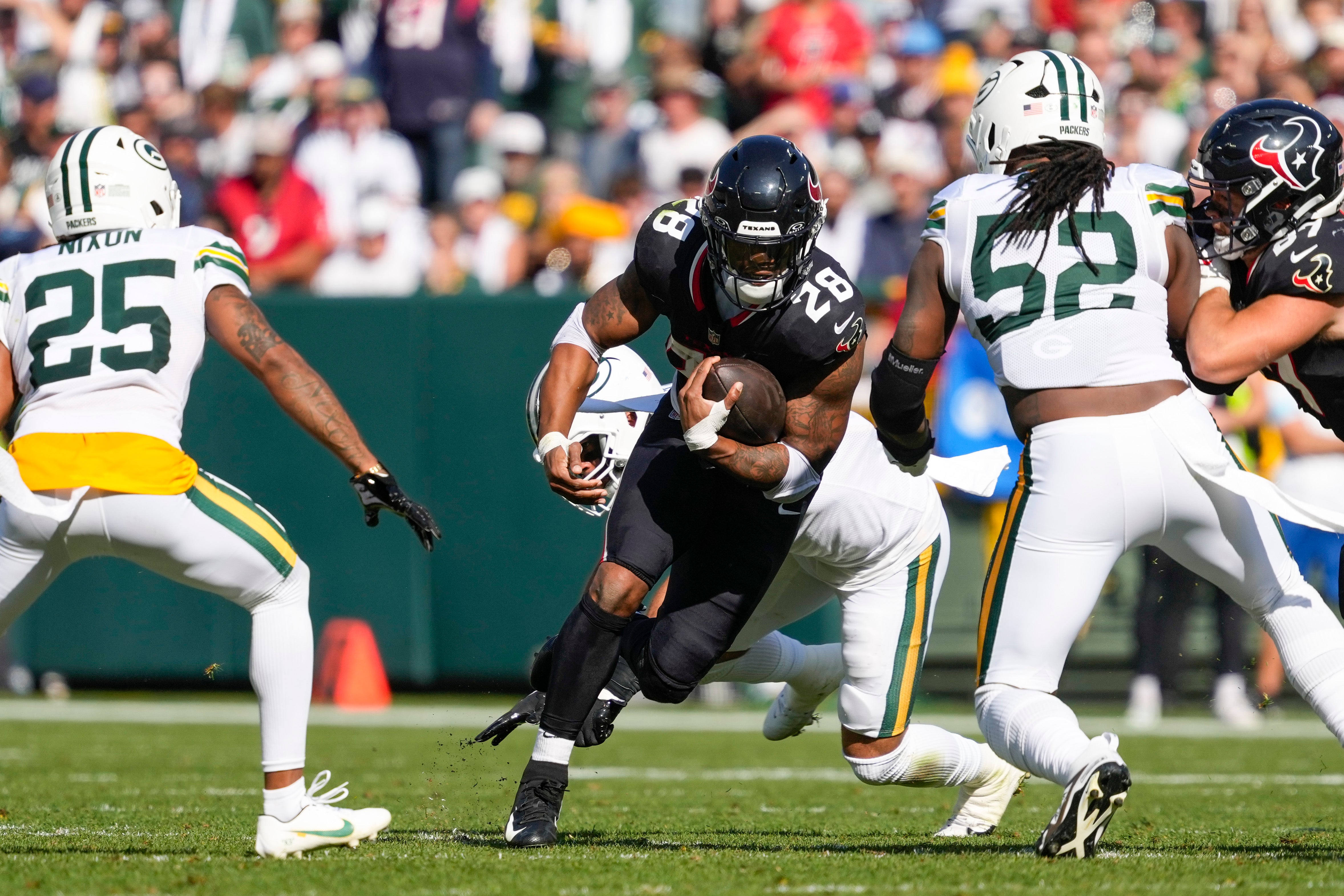 Houston Texans running back Joe Mixon (28) rushes with the football during the second quarter against the Green Bay Packers at Lambeau Field.