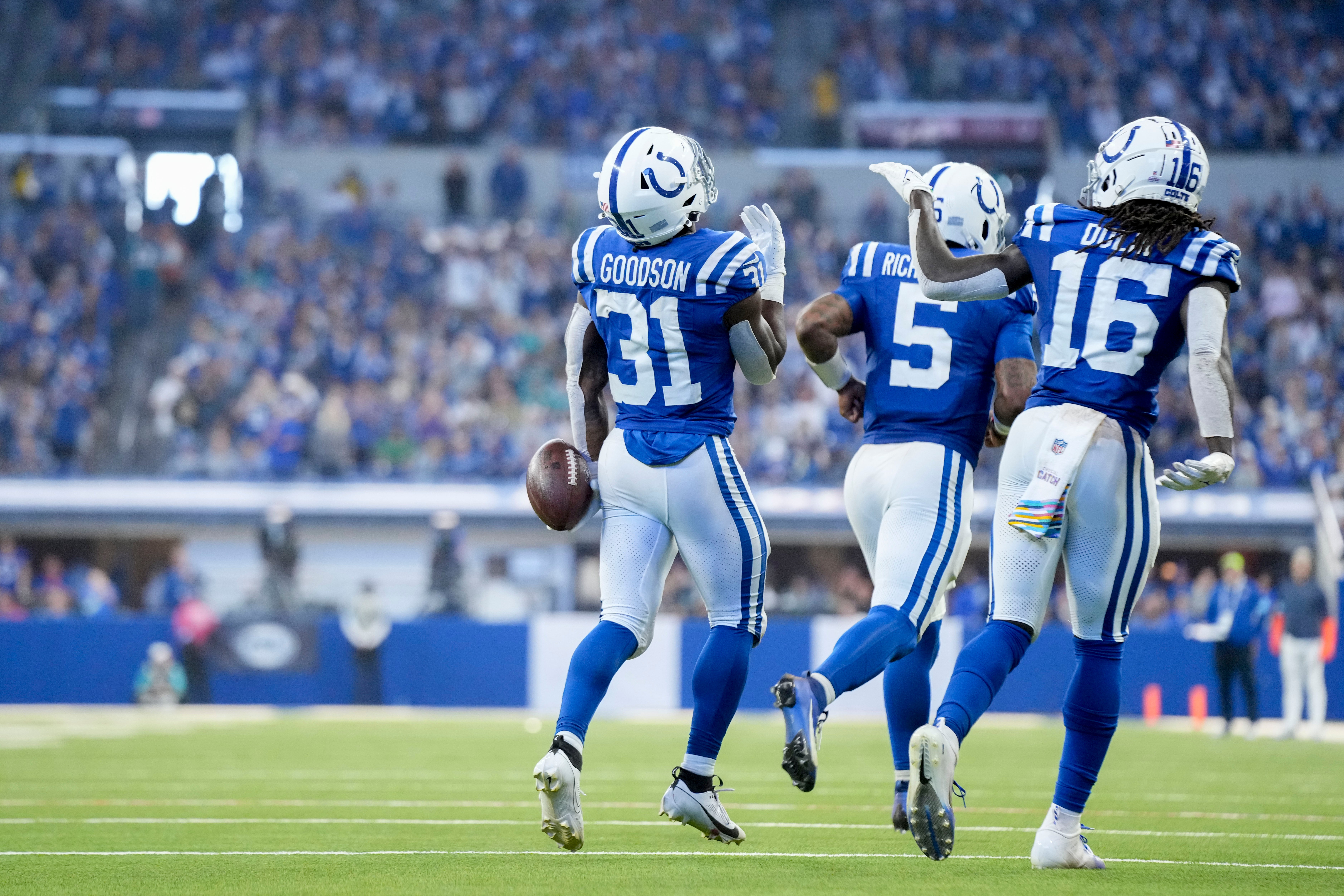 Oct 20, 2024; Indianapolis, Indiana, USA; Indianapolis Colts running back Tyler Goodson (31) celebrates with his teammates after scoring his first career touchdown during a game against the Miami Dolphins at Lucas Oil Stadium.