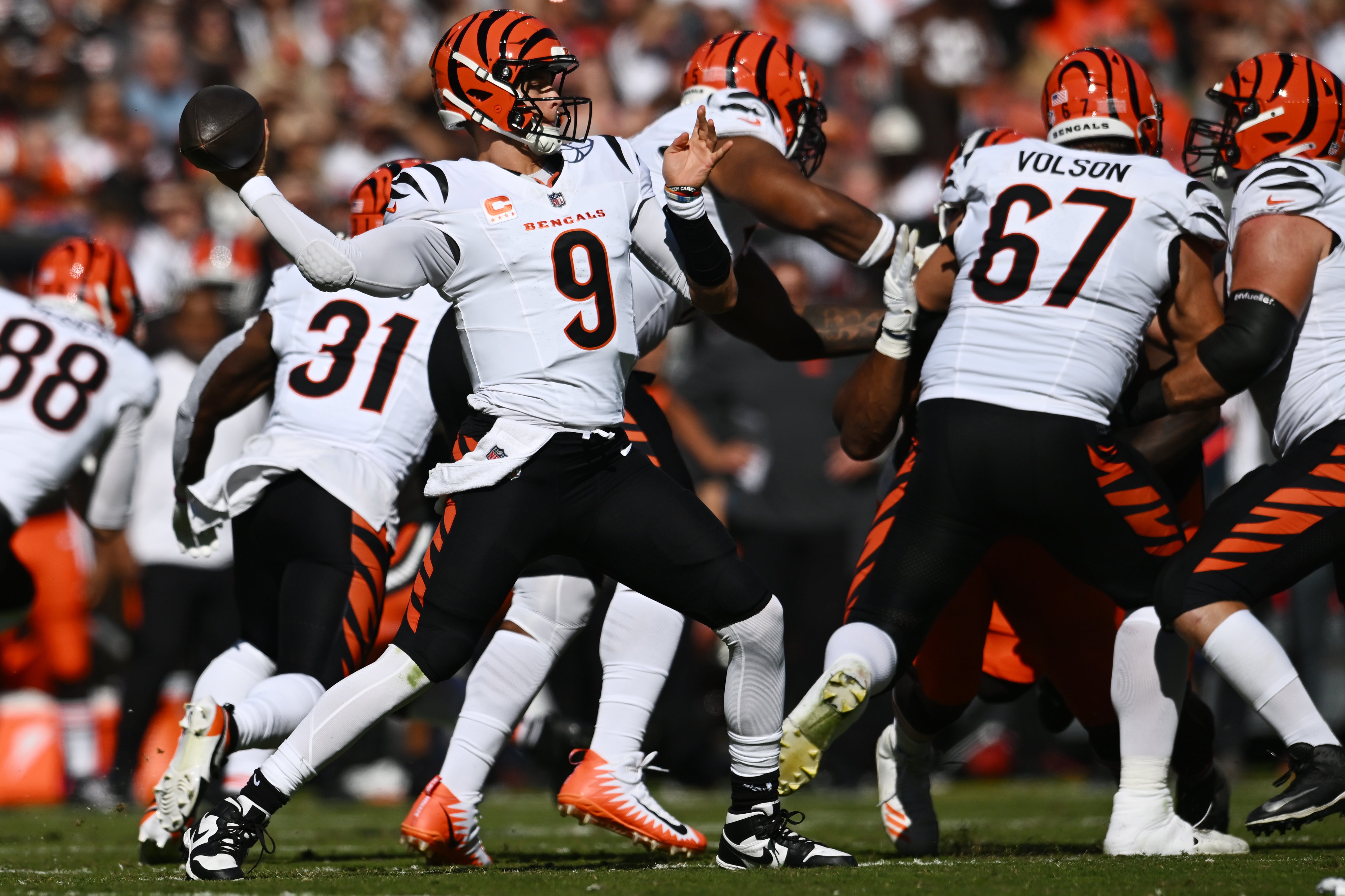 Oct 20, 2024; Cleveland, Ohio, USA; Cincinnati Bengals quarterback Joe Burrow (9) throws a pass during the first half against the Cleveland Browns at Huntington Bank Field.