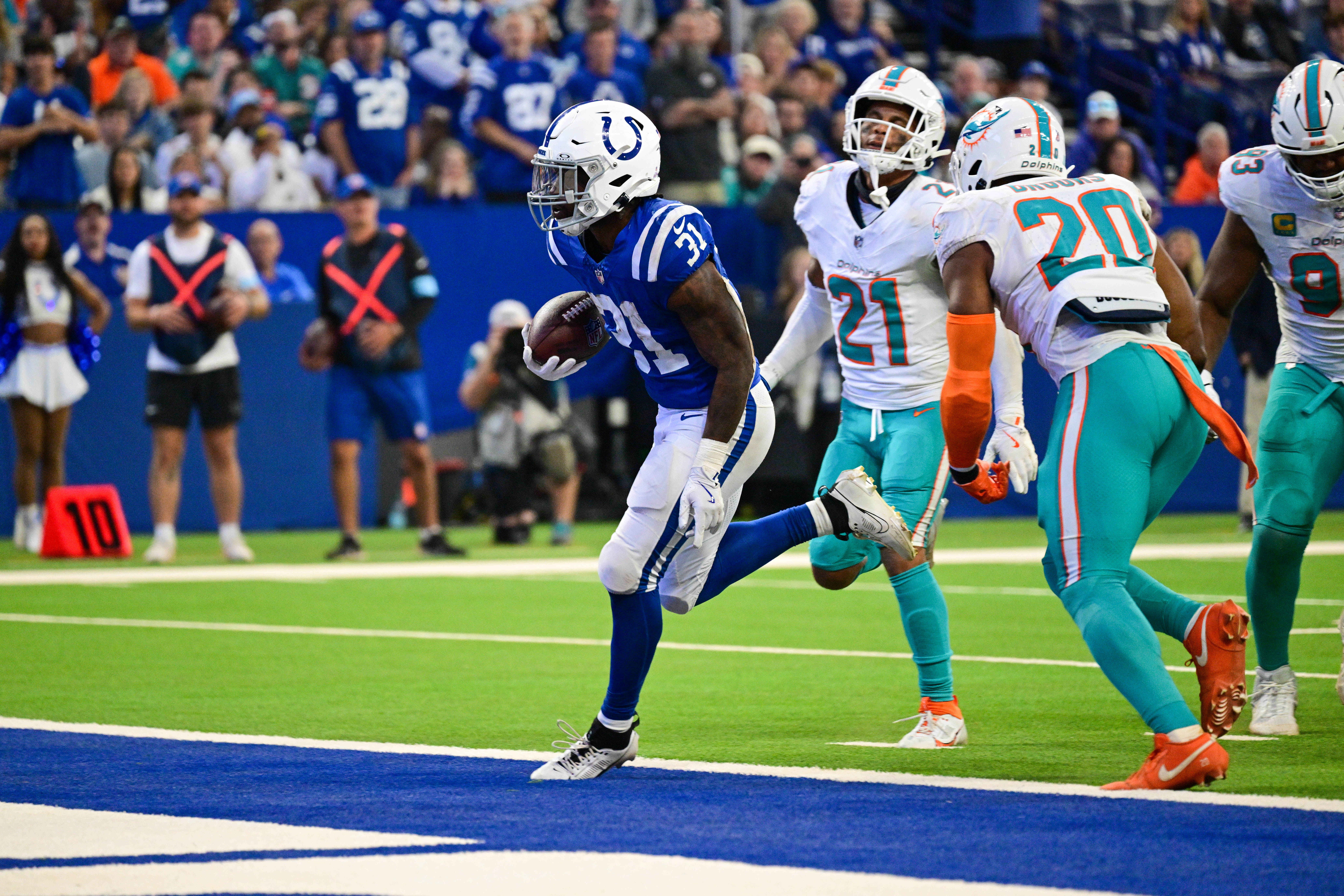 Oct 20, 2024; Indianapolis, Indiana, USA; Indianapolis Colts running back Tyler Goodson (31) scores a touchdown during the second half against the Miami Dolphins at Lucas Oil Stadium.