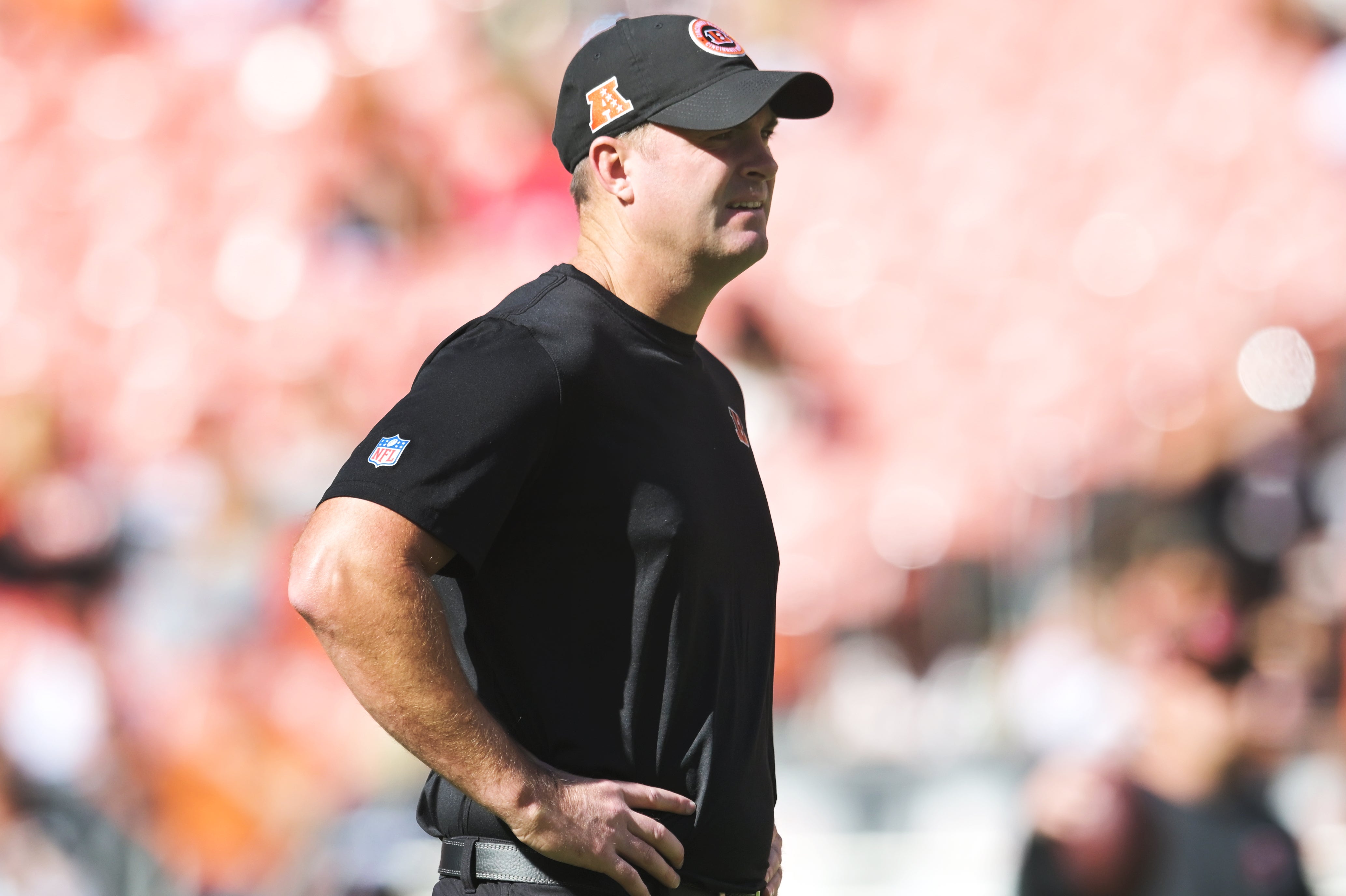 Oct 20, 2024; Cleveland, Ohio, USA; Cincinnati Bengals head coach Zac Taylor watches his team warm up before the game between the Cleveland Browns and the Bengals at Huntington Bank Field.