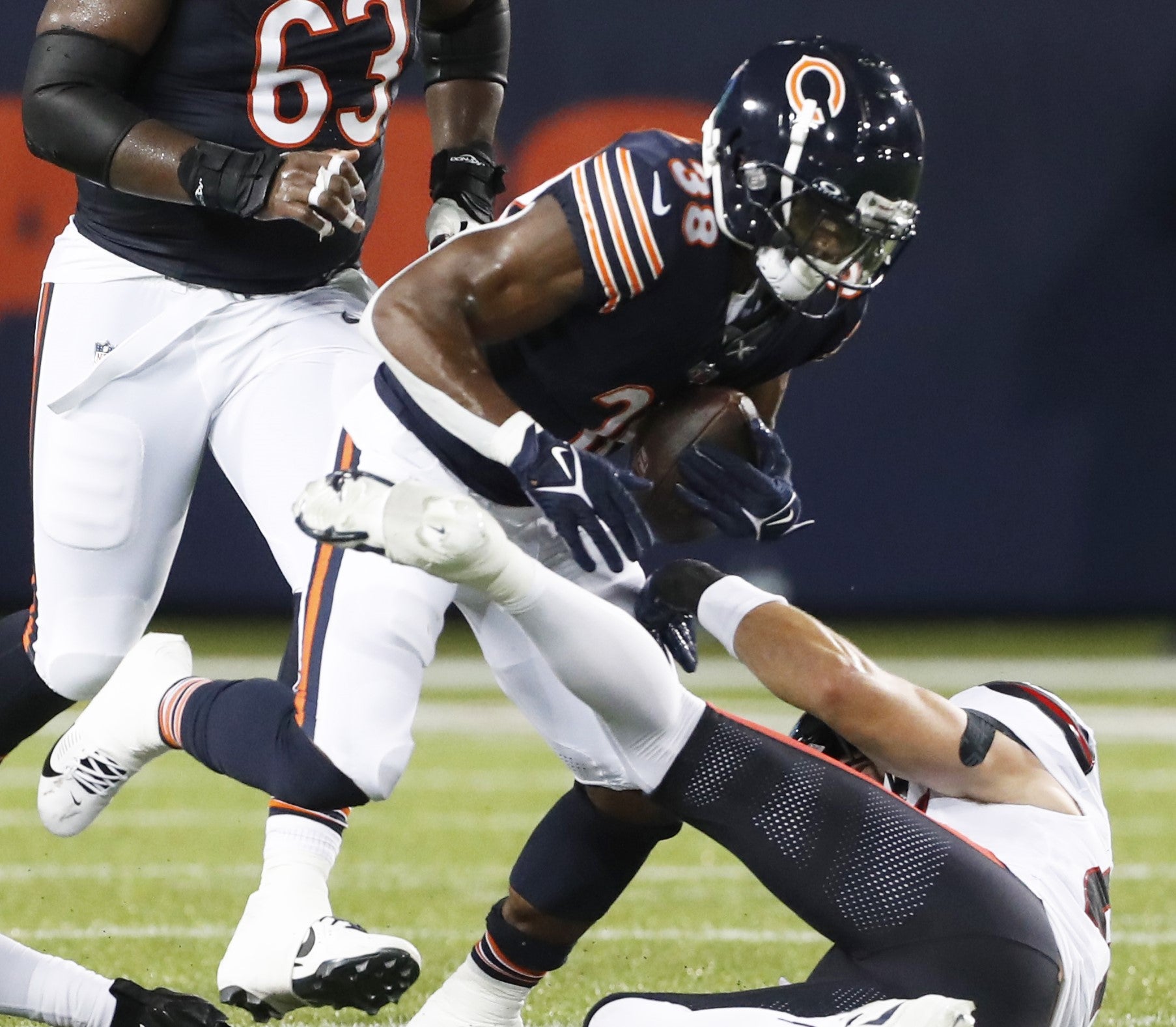 Aug 1, 2024; Canton, Ohio, USA; Chicago Bears running back Demetric Felton Jr. (38) runs the ball against Houston Texans linebacker Maxwell Tooley (right) during the third quarter at Tom Benson Hall of Fame Stadium.