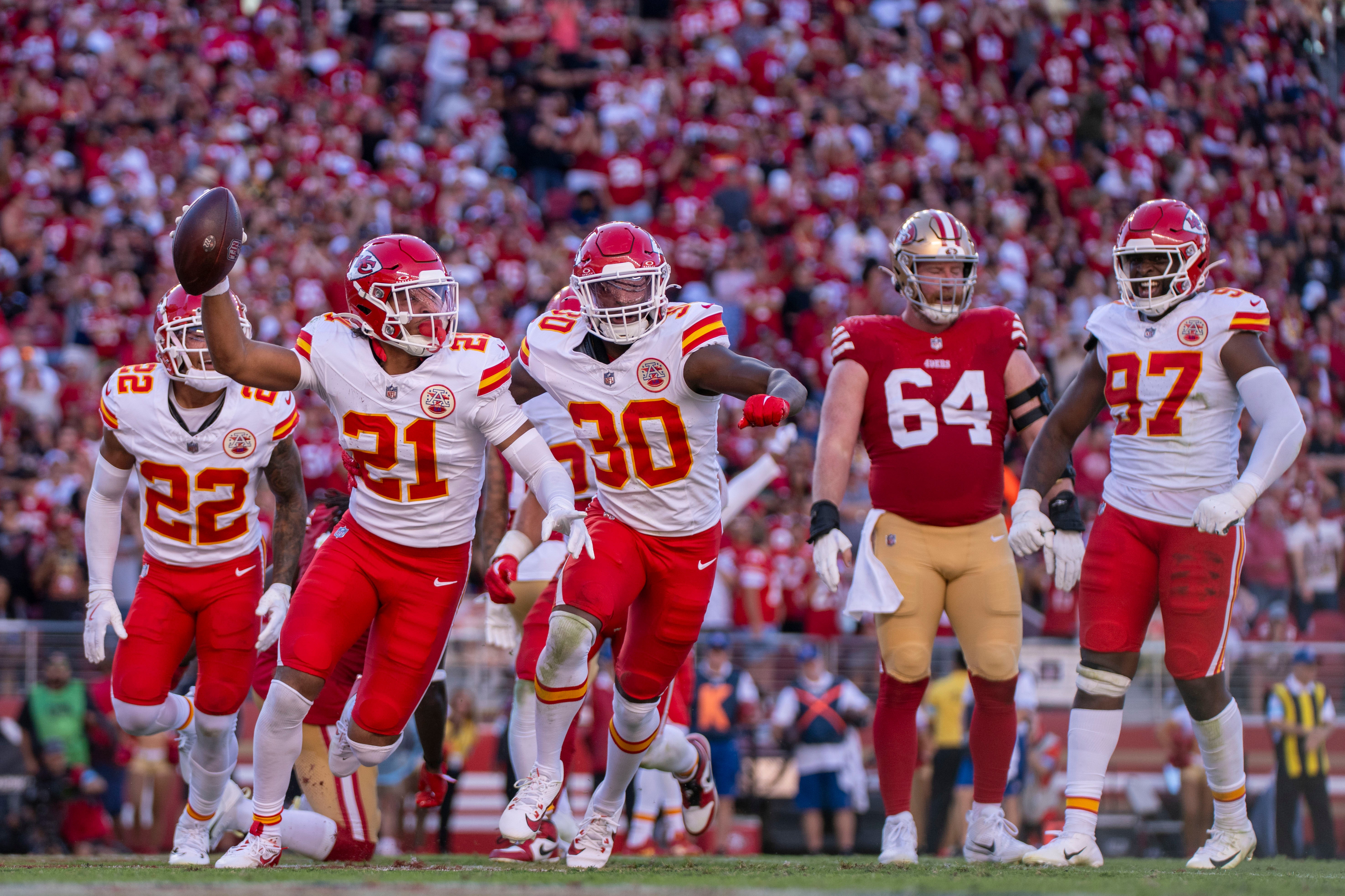 October 20, 2024; Santa Clara, California, USA; Kansas City Chiefs safety Jaden Hicks (21) celebrates intercepting the football against the San Francisco 49ers during the fourth quarter at Levi's Stadium.