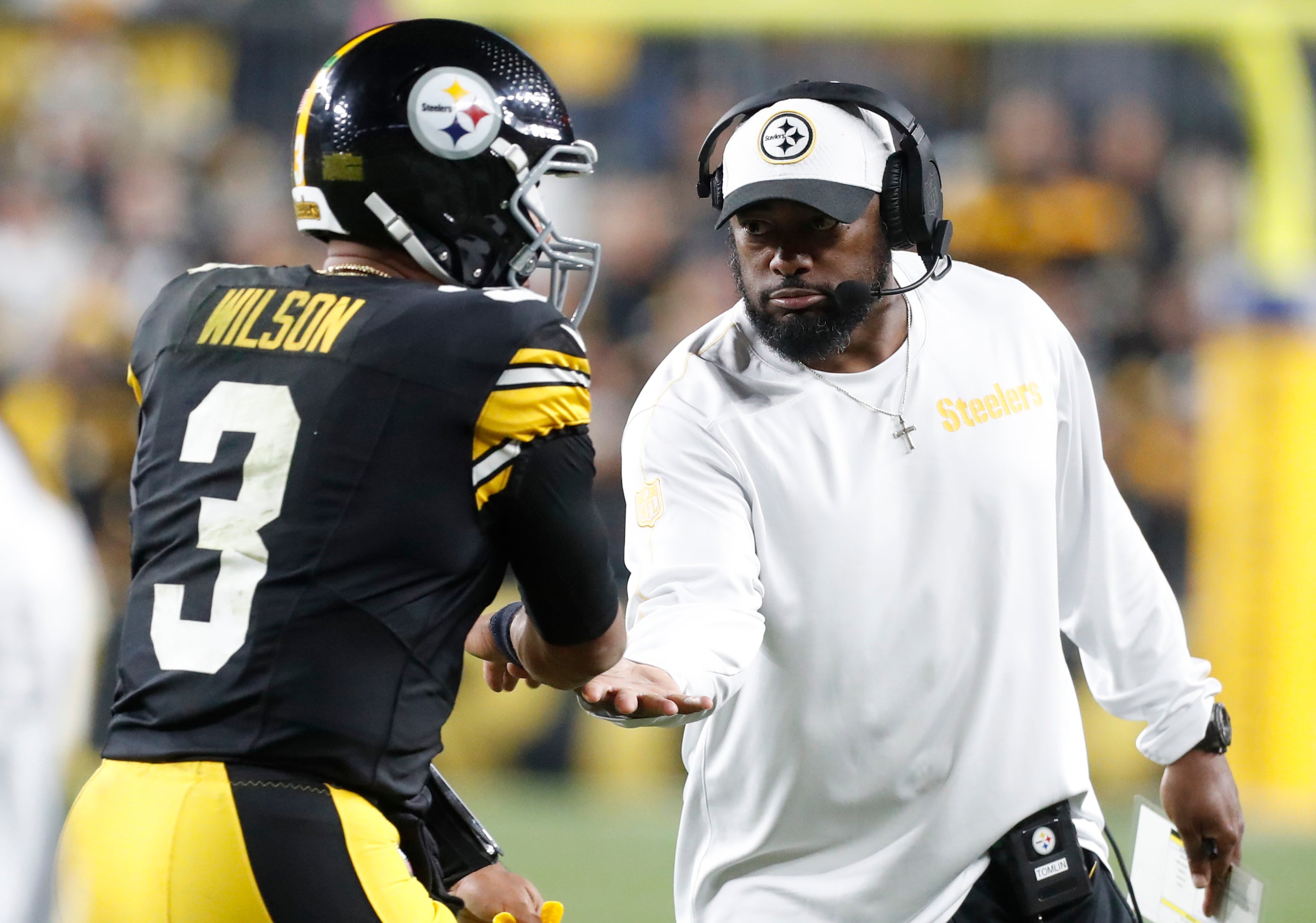 Oct 20, 2024; Pittsburgh, Pennsylvania, USA; Pittsburgh Steelers head coach Mike Tomlin (right) congratulates quarterback Russell Wilson (3) on his touchdown pass against the New York Jets during the second quarter at Acrisure Stadium.