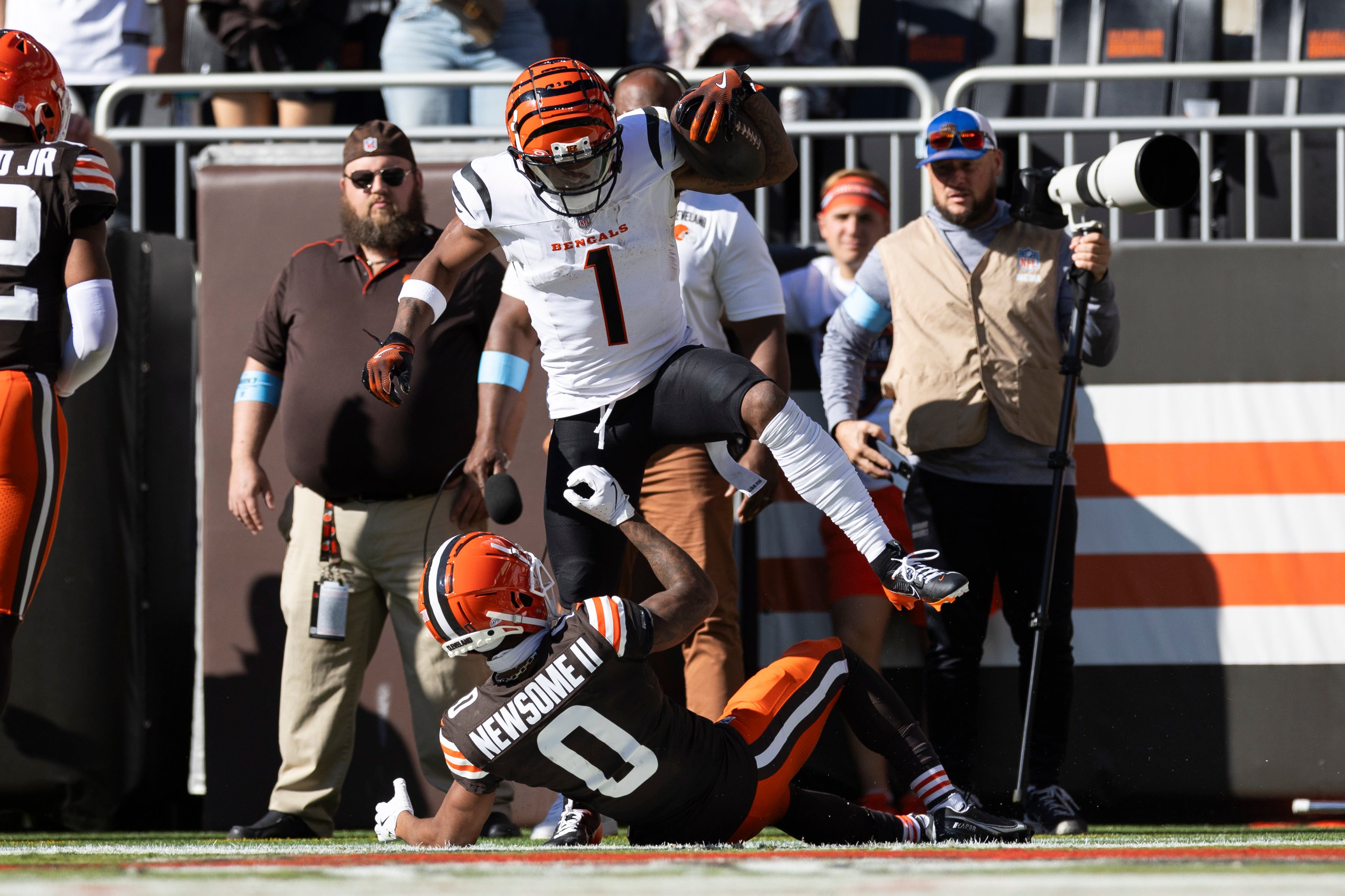 Oct 20, 2024; Cleveland, Ohio, USA; Cincinnati Bengals wide receiver Ja'Marr Chase (1) celebrates his touchdown over Cleveland Browns cornerback Greg Newsome II (0) during the third quarter at Huntington Bank Field.