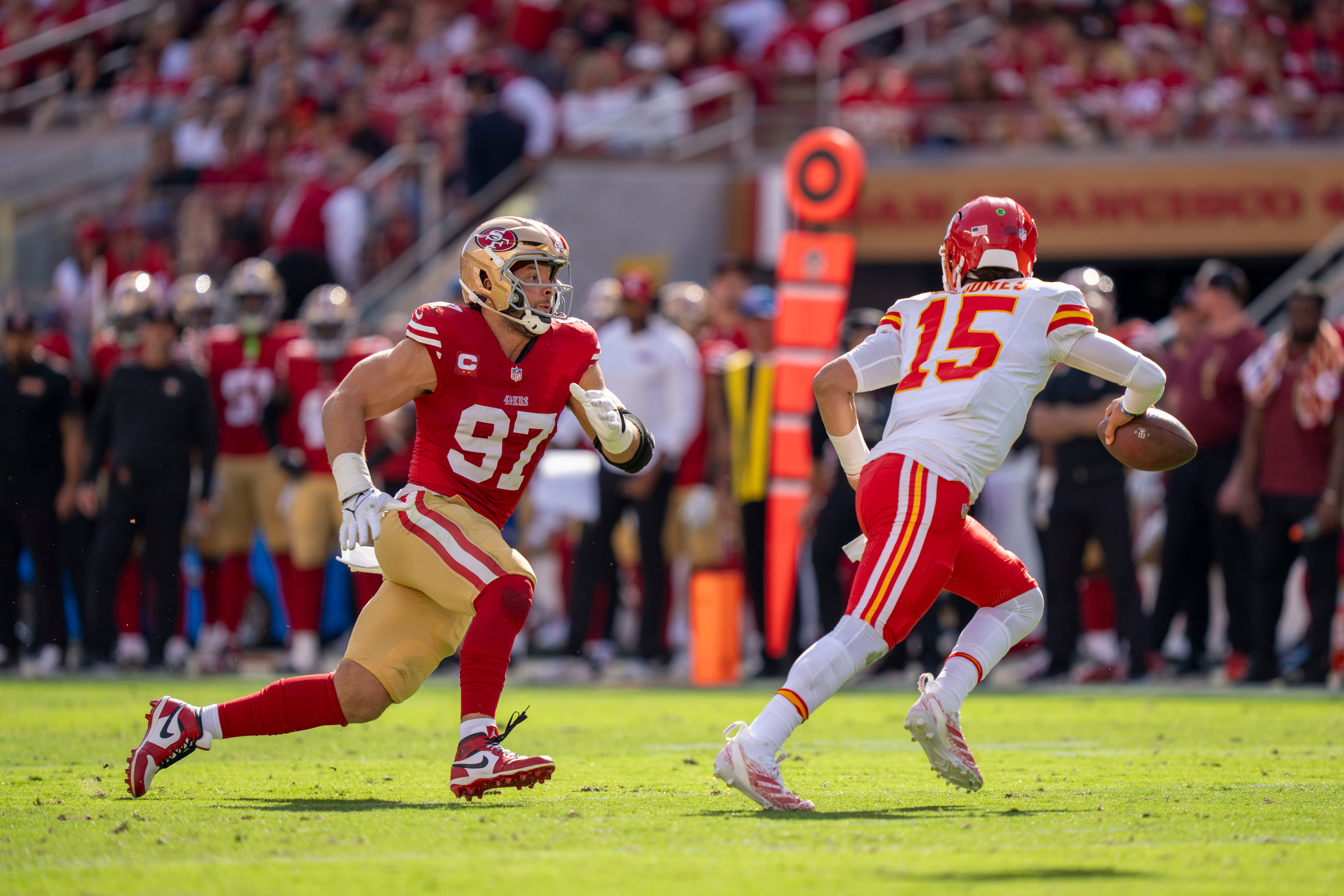 San Francisco 49ers defensive end Nick Bosa (97) defends against Kansas City Chiefs quarterback Patrick Mahomes (15) during the second quarter at Levi's Stadium.