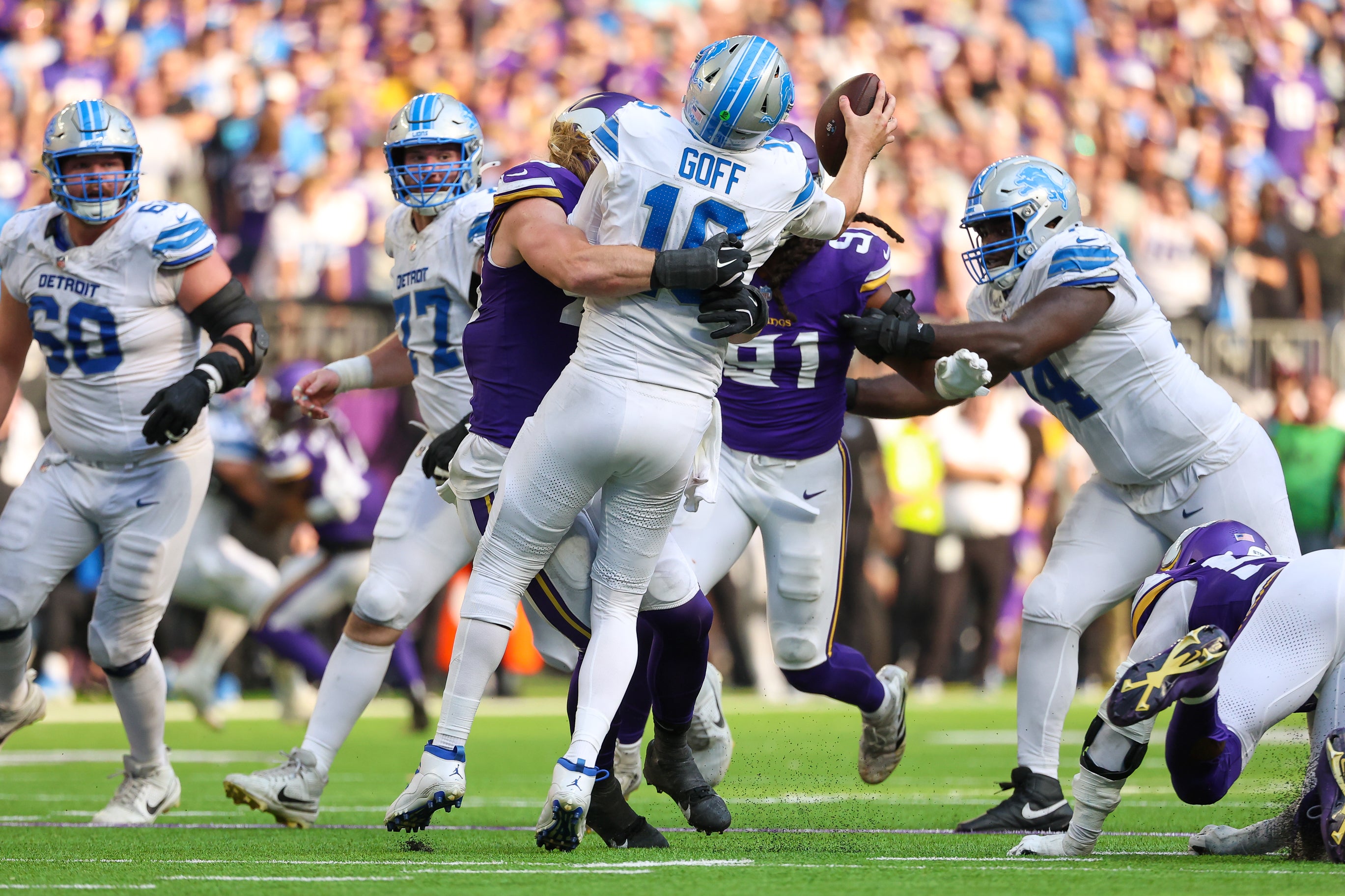 Oct 20, 2024; Minneapolis, Minnesota, USA; Minnesota Vikings linebacker Andrew Van Ginkel (43) tackles Detroit Lions quarterback Jared Goff (16) during the fourth quarter at U.S. Bank Stadium.