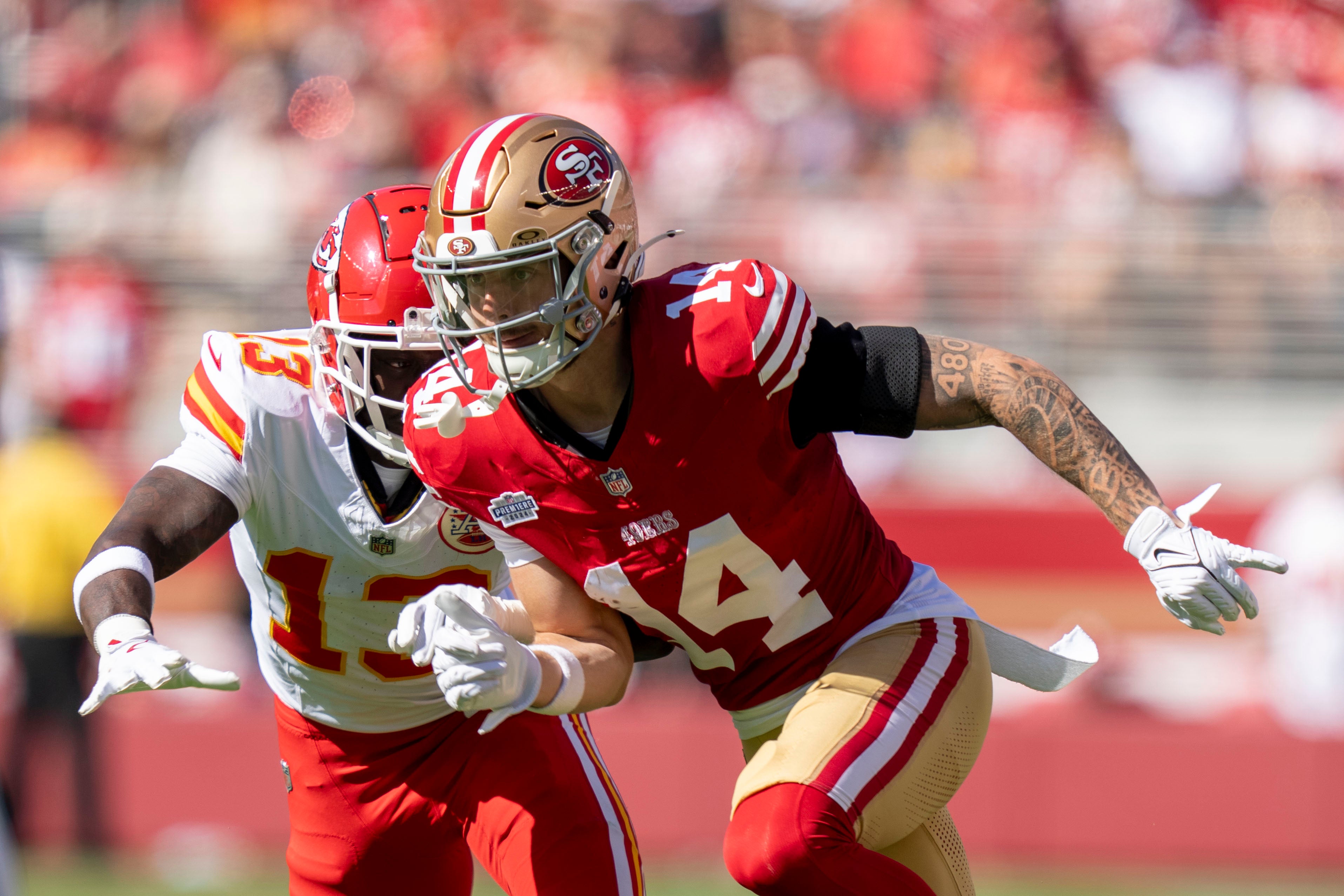 San Francisco 49ers wide receiver Ricky Pearsall (14) runs against Kansas City Chiefs safety Nazeeh Johnson (13) during the first quarter at Levi's Stadium.