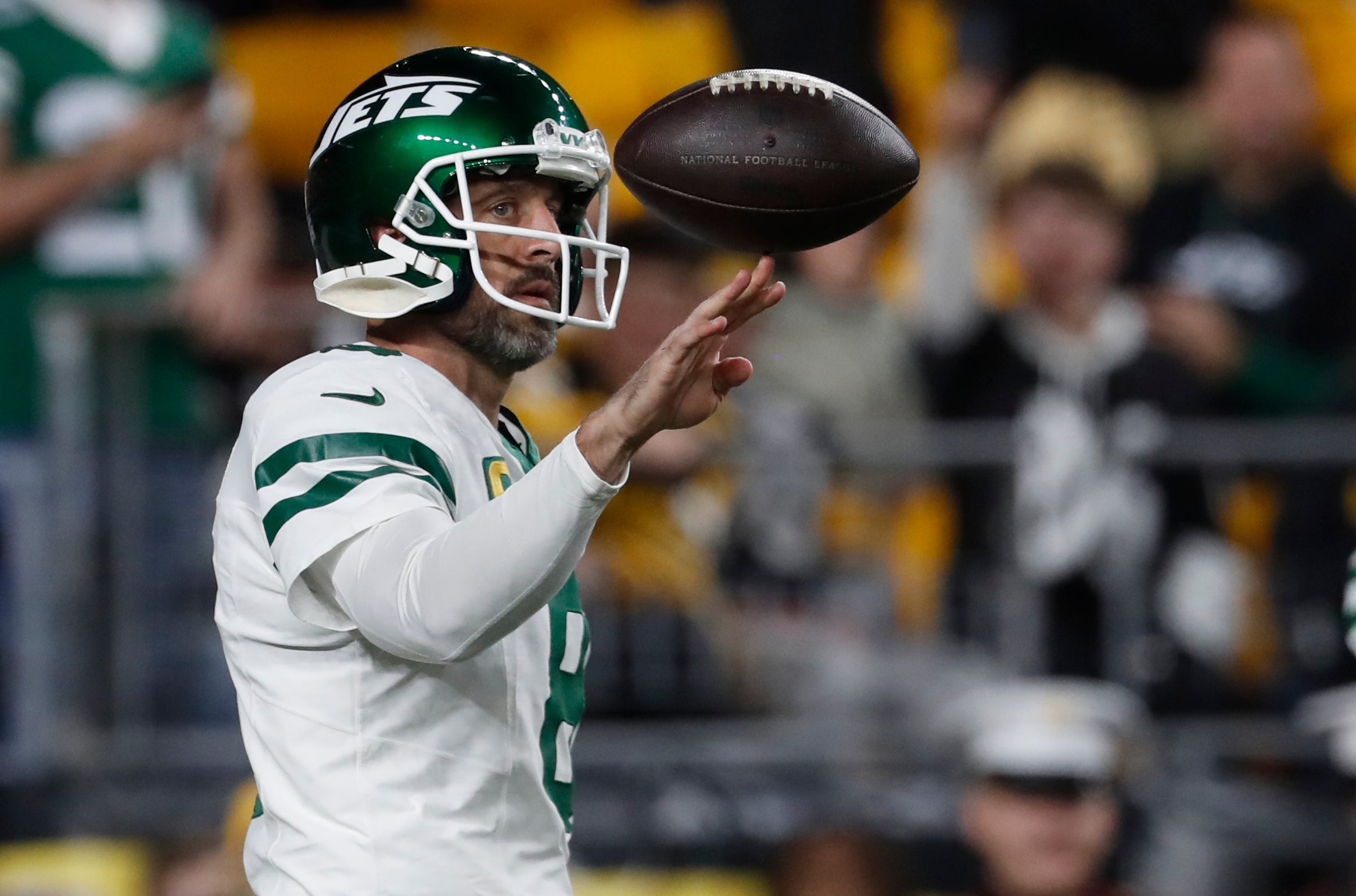 New York Jets quarterback Aaron Rodgers (8) warms up before the game against the Pittsburgh Steelers at Acrisure Stadium.