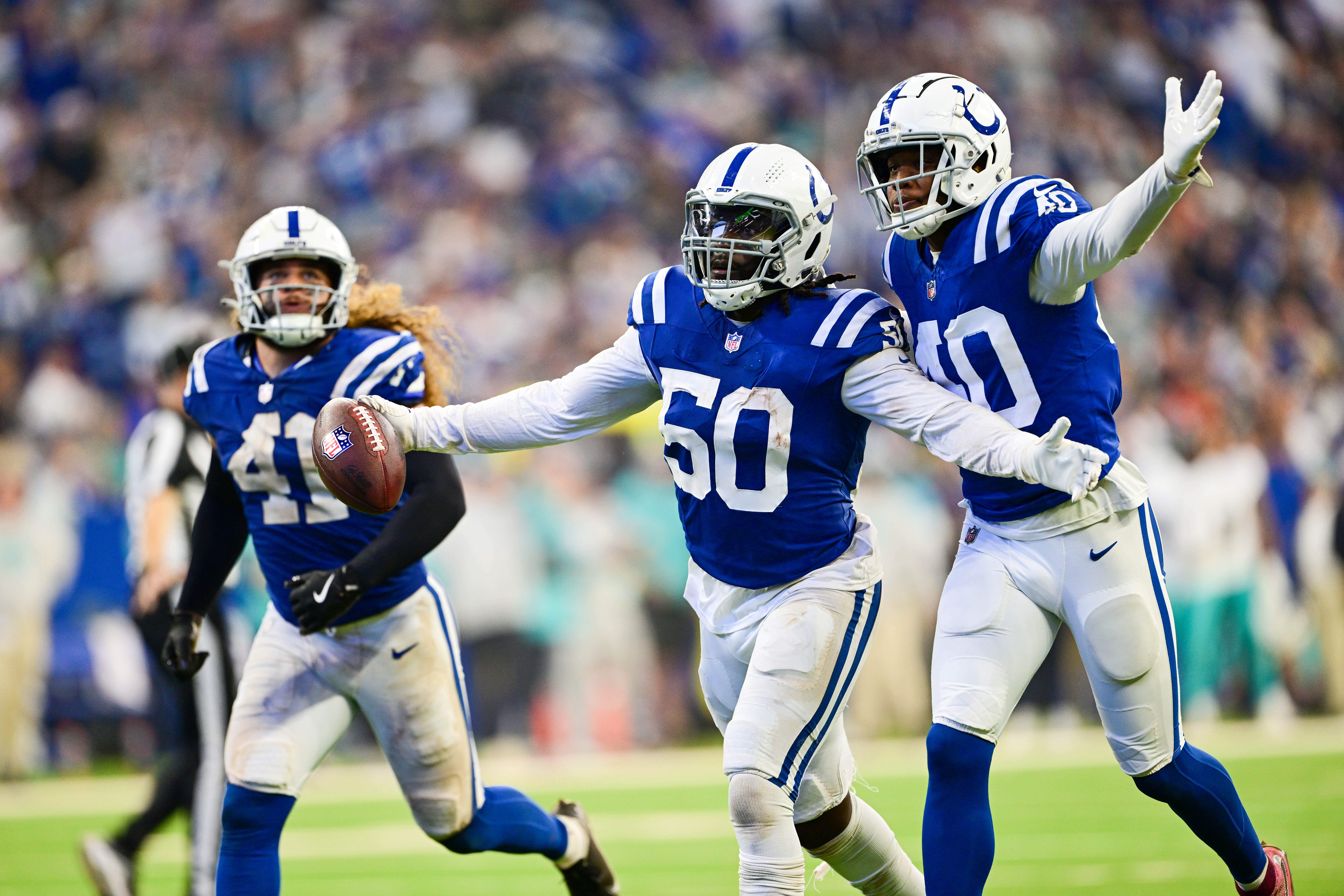 Oct 20, 2024; Indianapolis, Indiana, USA; Indianapolis Colts linebacker Segun Olubi (50) and cornerback Jaylon Jones (40) celebrate a fumble recovery during the second half against the Miami Dolphins at Lucas Oil Stadium.