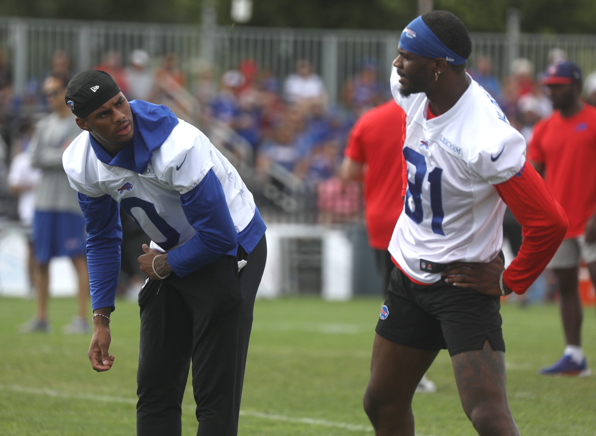 Bills WRs Keon Coleman and Marquez Valdes-Scantling chat while stretching at Bills training camp.
