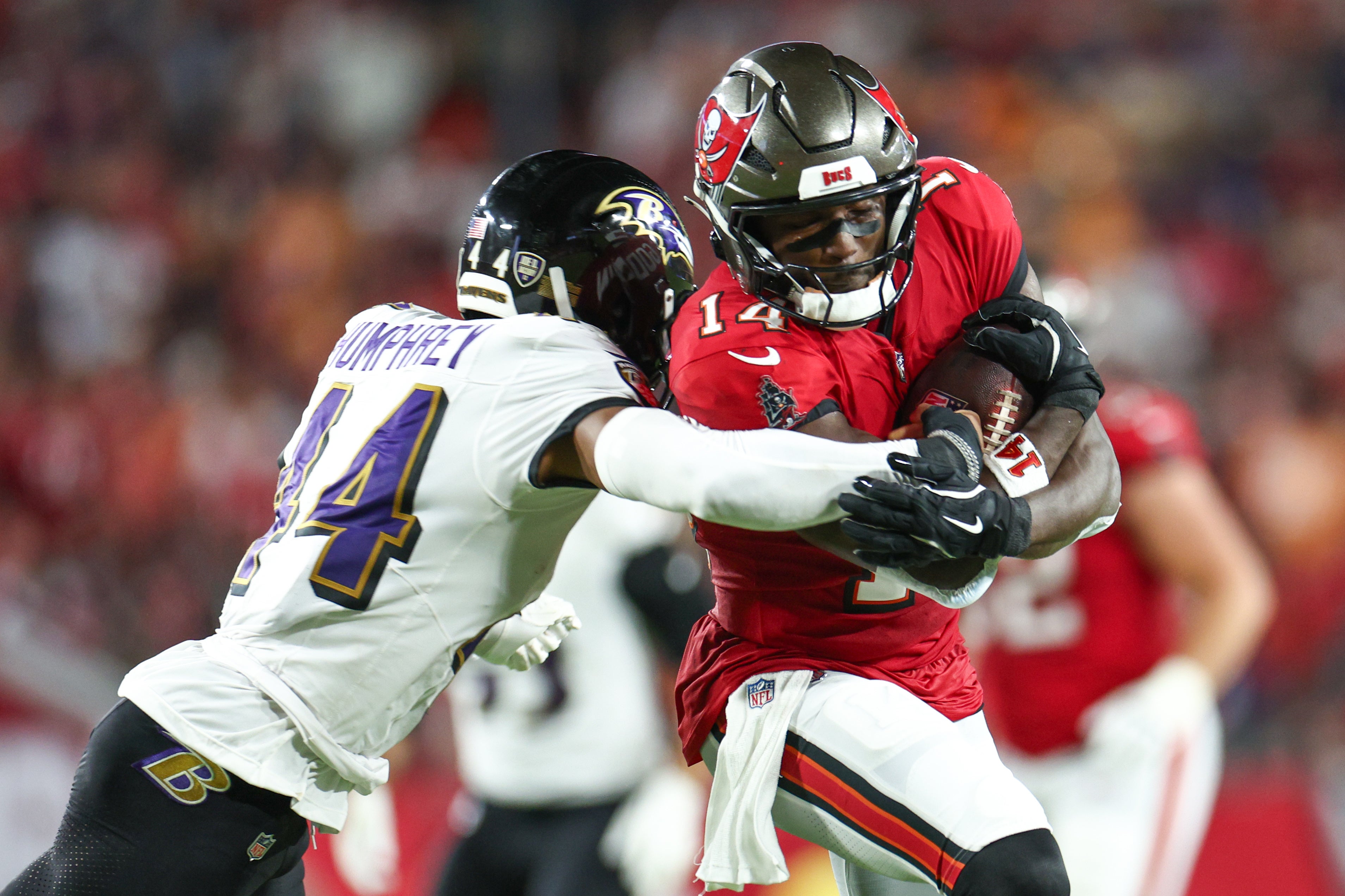 Oct 21, 2024; Tampa, Florida, USA; Tampa Bay Buccaneers wide receiver Chris Godwin (14) is pressured by Baltimore Ravens cornerback Marlon Humphrey (44) in the second quarter at Raymond James Stadium.