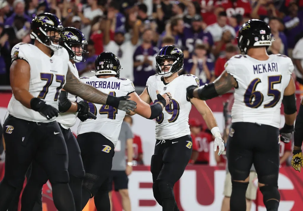 Baltimore Ravens tight end Mark Andrews (89) celebrates with teammates after he scored a touchdown against the Tampa Bay Buccaneers during the first half at Raymond James Stadium.