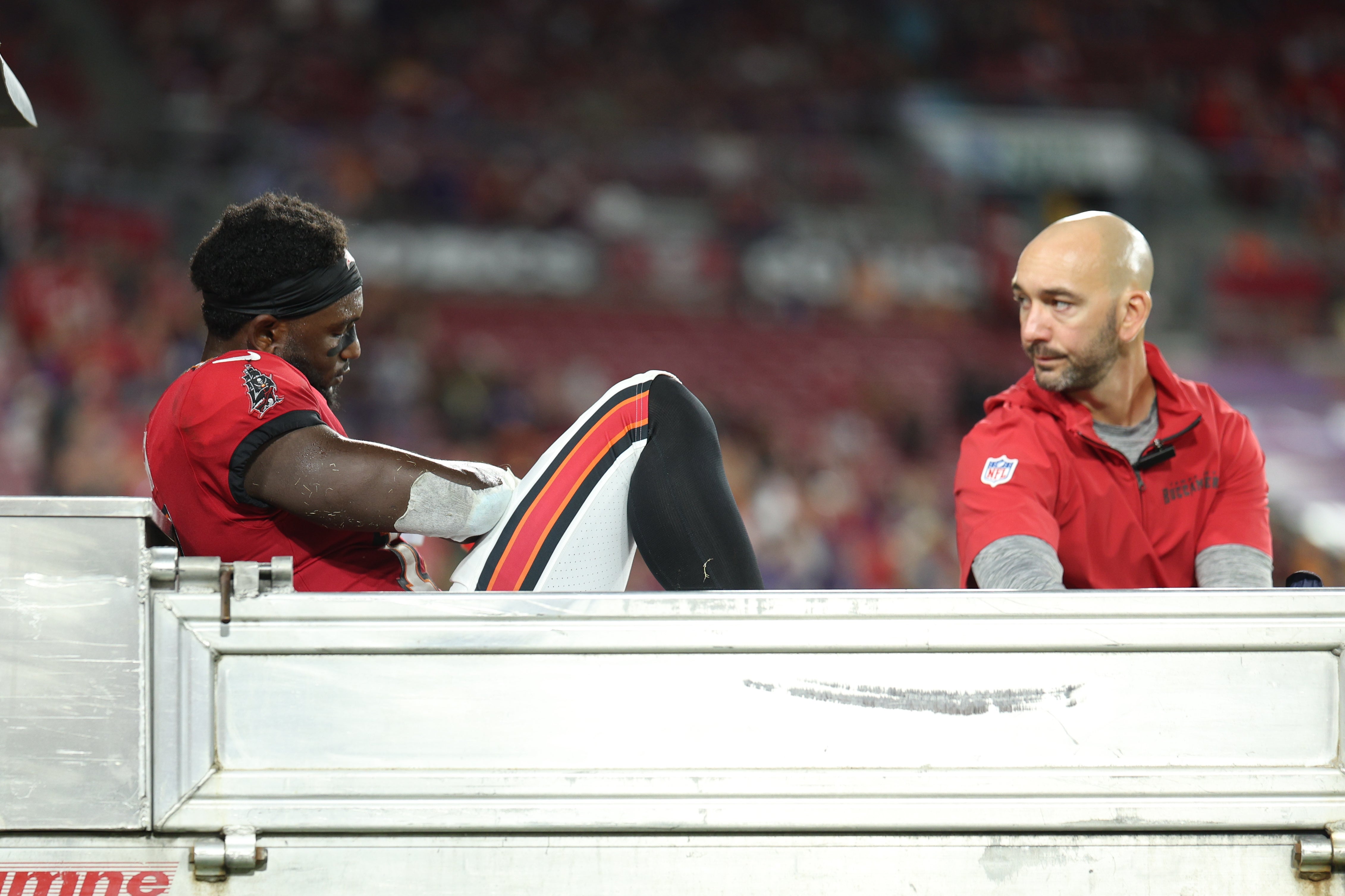 Oct 21, 2024; Tampa, Florida, USA; Tampa Bay Buccaneers wide receiver Chris Godwin (14) is carted off the field against the Baltimore Ravens in the fourth quarter at Raymond James Stadium.