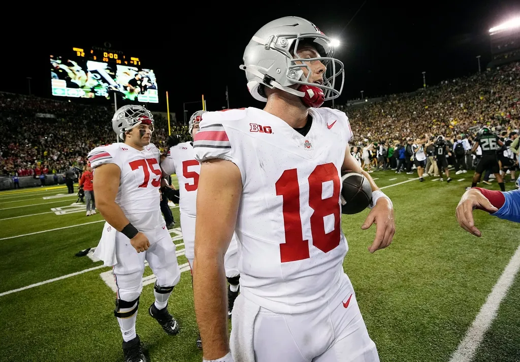 Ohio State Buckeyes quarterback Will Howard (18) walks off the field after losing 32-31 to Oregon Ducks during the NCAA football game at Autzen Stadium