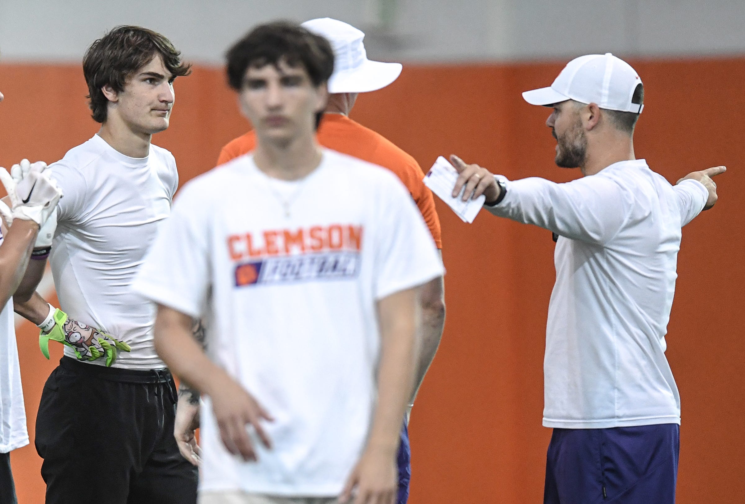 Marshall Pritchett, left, Class of 2025 receiver/tight end from Rabun Gap, talks near Clemson offensive coordinator Garrett Riley, right, during the first of the 2023 Dabo Swinney High School Camps at the practice facilities at Clemson University in Clemson, S.C. Wednesday, May 31, 2023.
