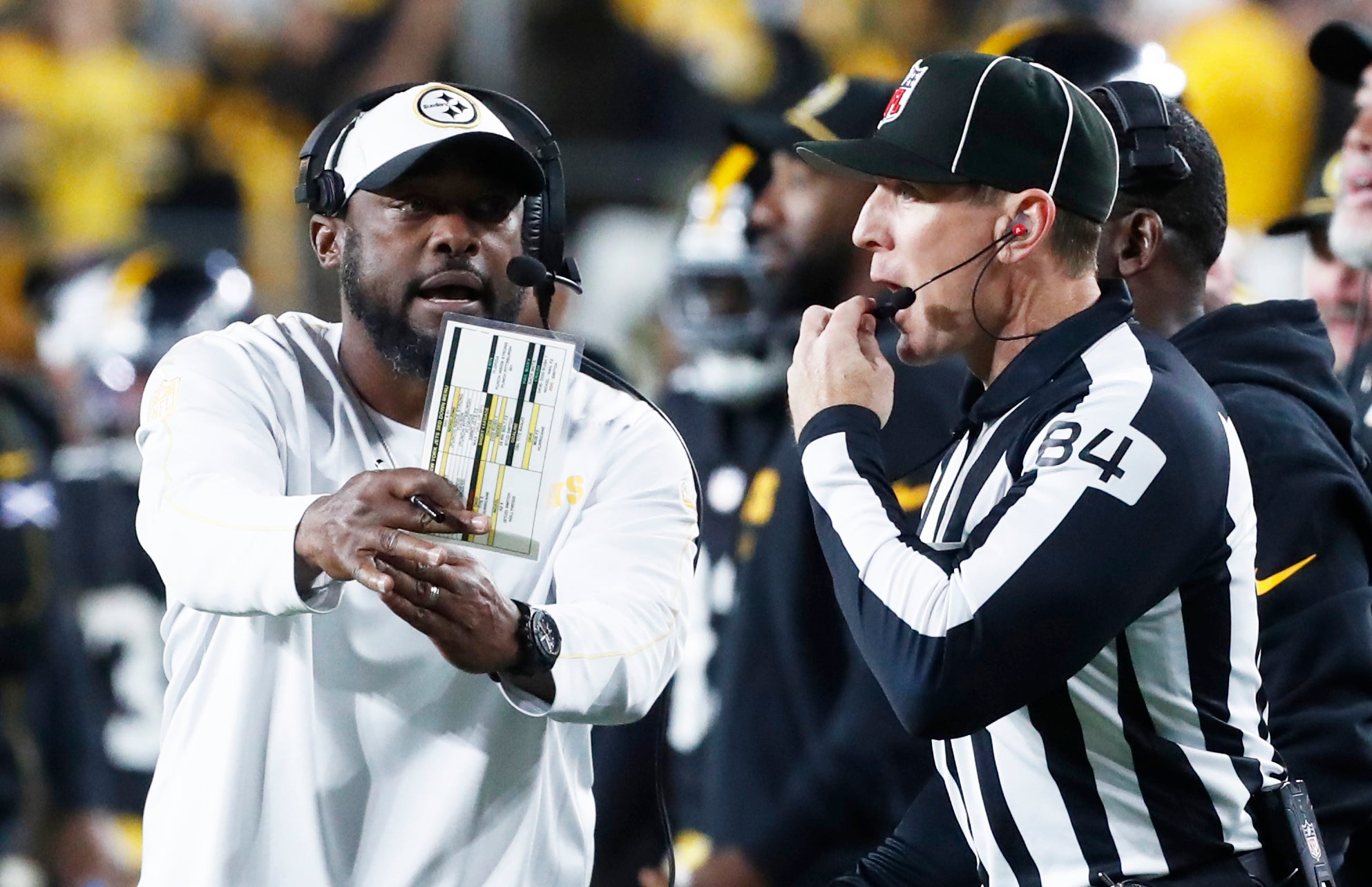 Oct 20, 2024; Pittsburgh, Pennsylvania, USA; Pittsburgh Steelers head coach Mike Tomlin (left) asks line judge Jay Bilbo (84) for a time-out against the New York Jets during the fourth quarter at Acrisure Stadium.