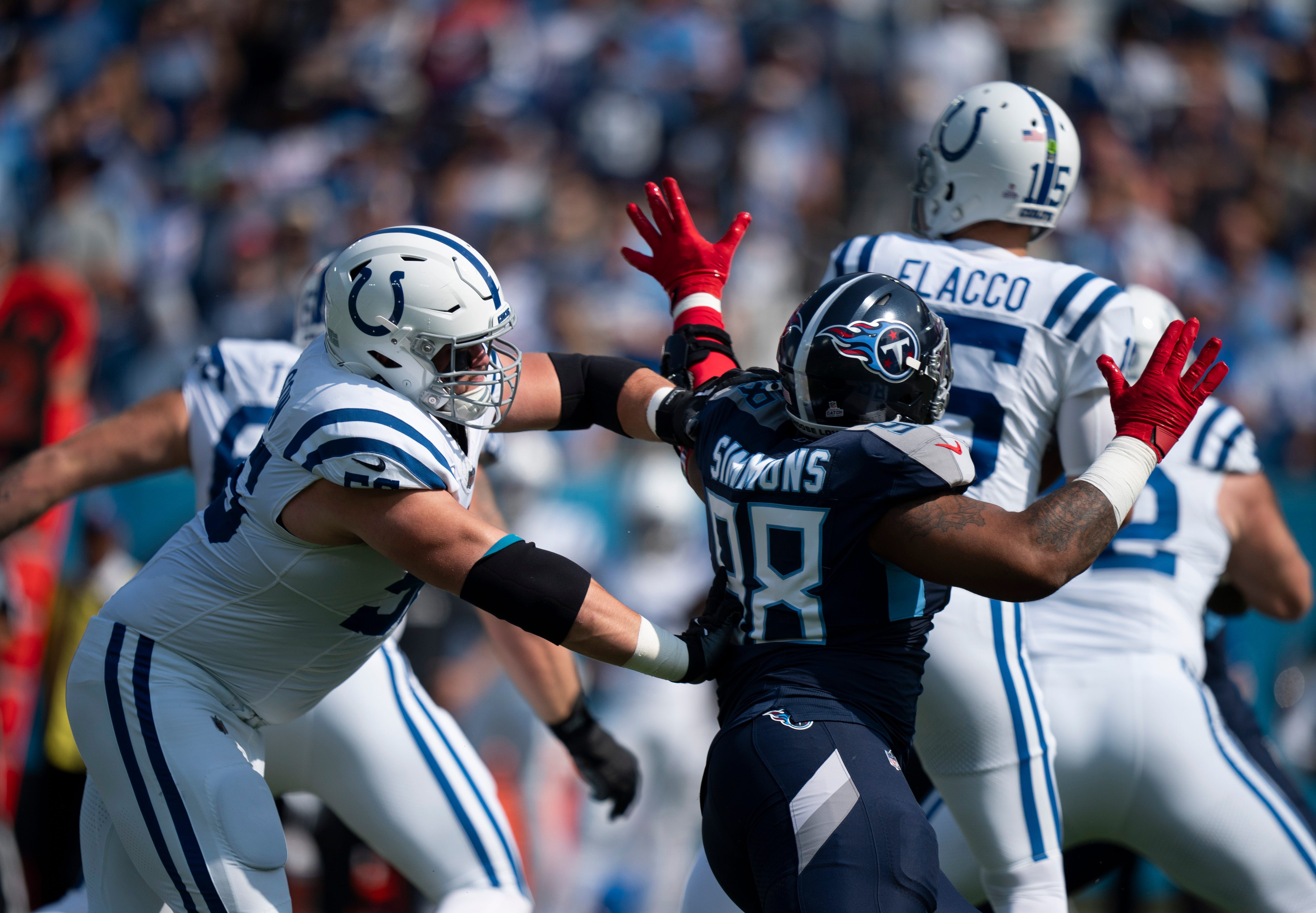 Indianapolis Colts guard Quenton Nelson (56) stops Tennessee Titans defensive tackle Jeffery Simmons (98) from getting to the quarterback during the first quarter their game at Nissan Stadium in Nashville, Tenn., Sunday, Oct. 13, 2024.