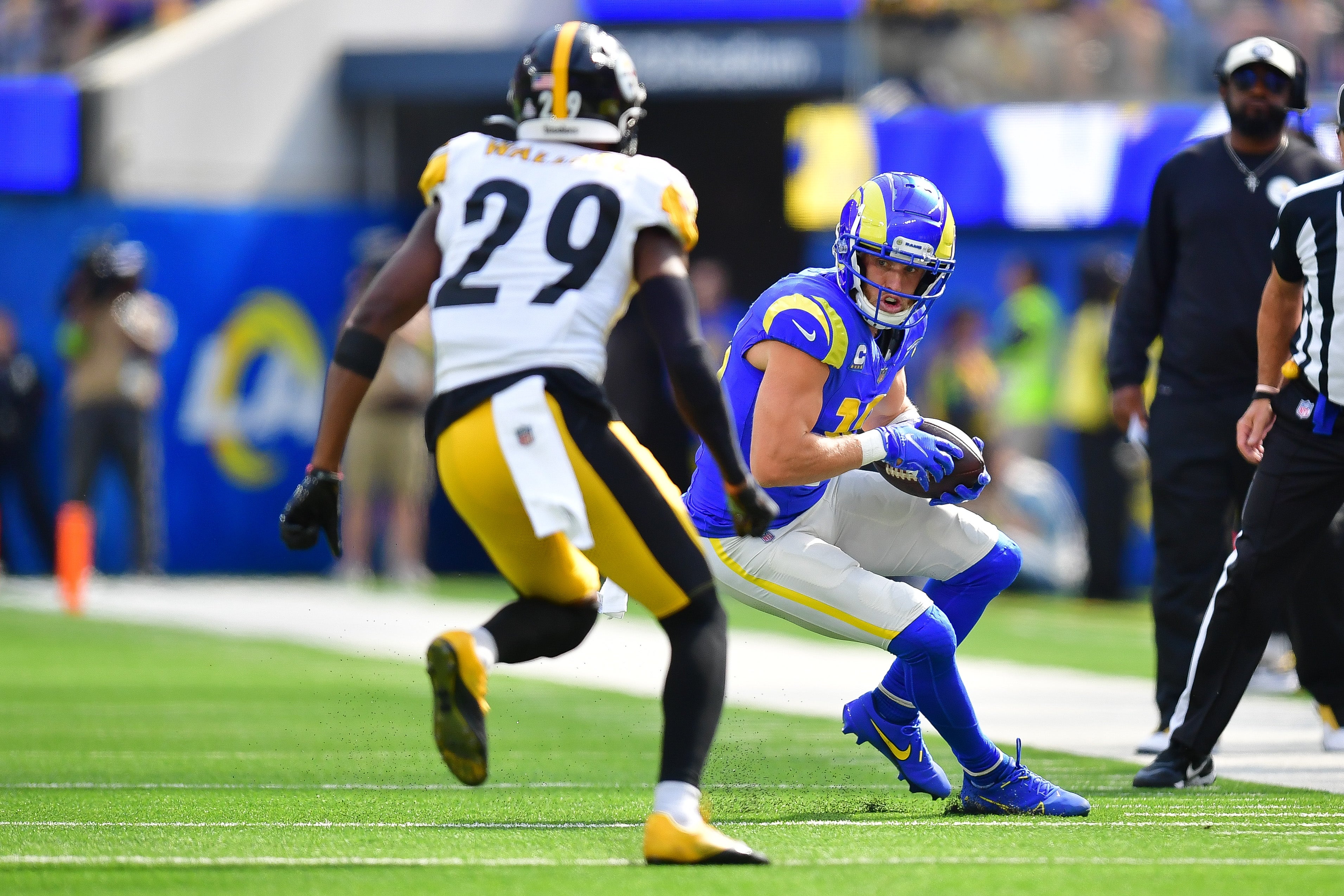 Oct 22, 2023; Inglewood, California, USA; Los Angeles Rams wide receiver Cooper Kupp (10) runs the ball against Pittsburgh Steelers cornerback Levi Wallace (29) during the first half at SoFi Stadium.