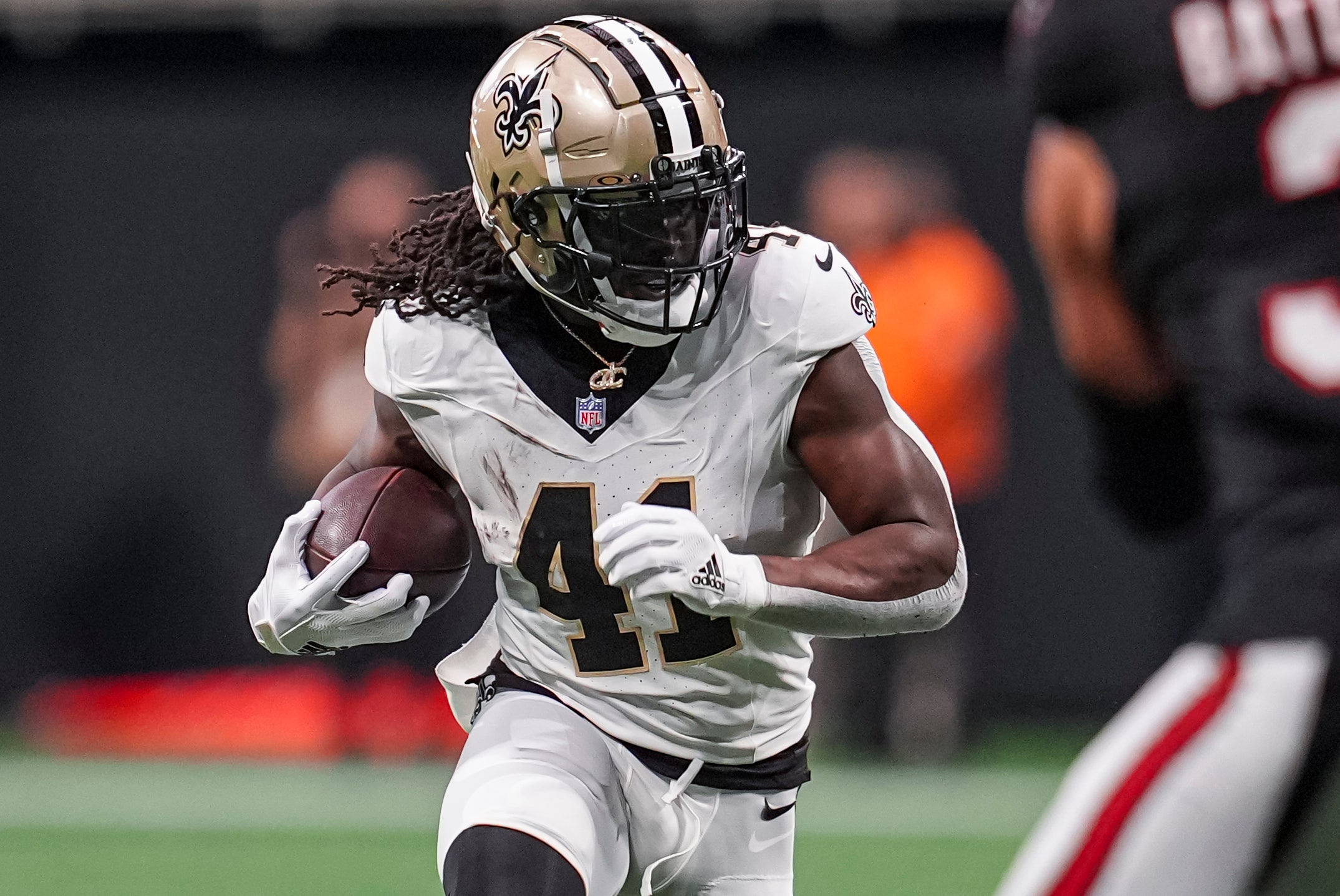 Sep 29, 2024; Atlanta, Georgia, USA; New Orleans Saints running back Alvin Kamara (41) runs against the Atlanta Falcons at Mercedes-Benz Stadium.