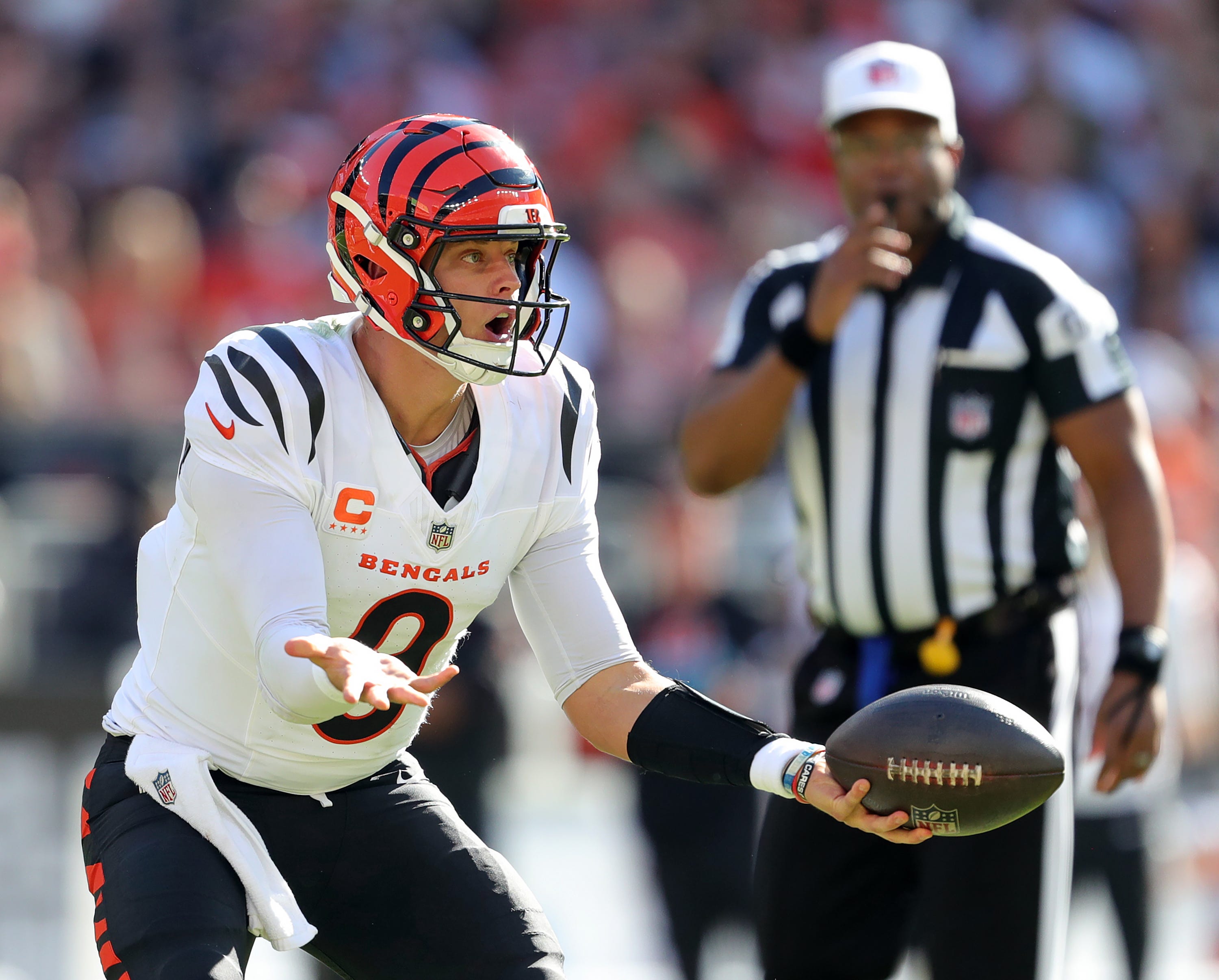 Cincinnati Bengals quarterback Joe Burrow (9) reacts to a penalty during the second half of an NFL football game at Huntington Bank Field, Sunday, Oct. 20, 2024, in Cleveland, Ohio.  