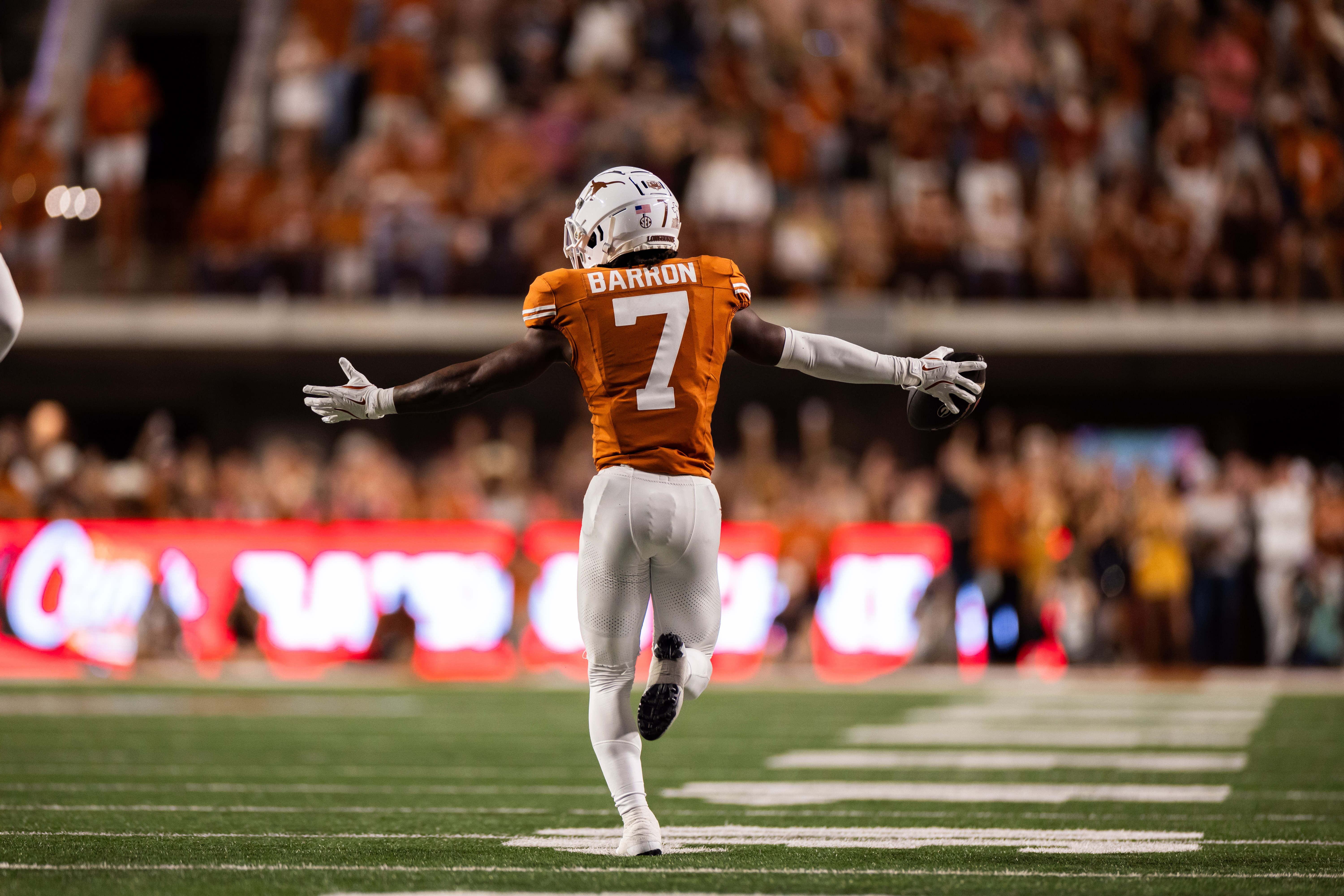 Texas Longhorns cornerback Jahdae Barron (7) celebrates an interception in the first quarter against the Georgia Bulldogs at Darrell K Royal-Texas Memorial Stadium.