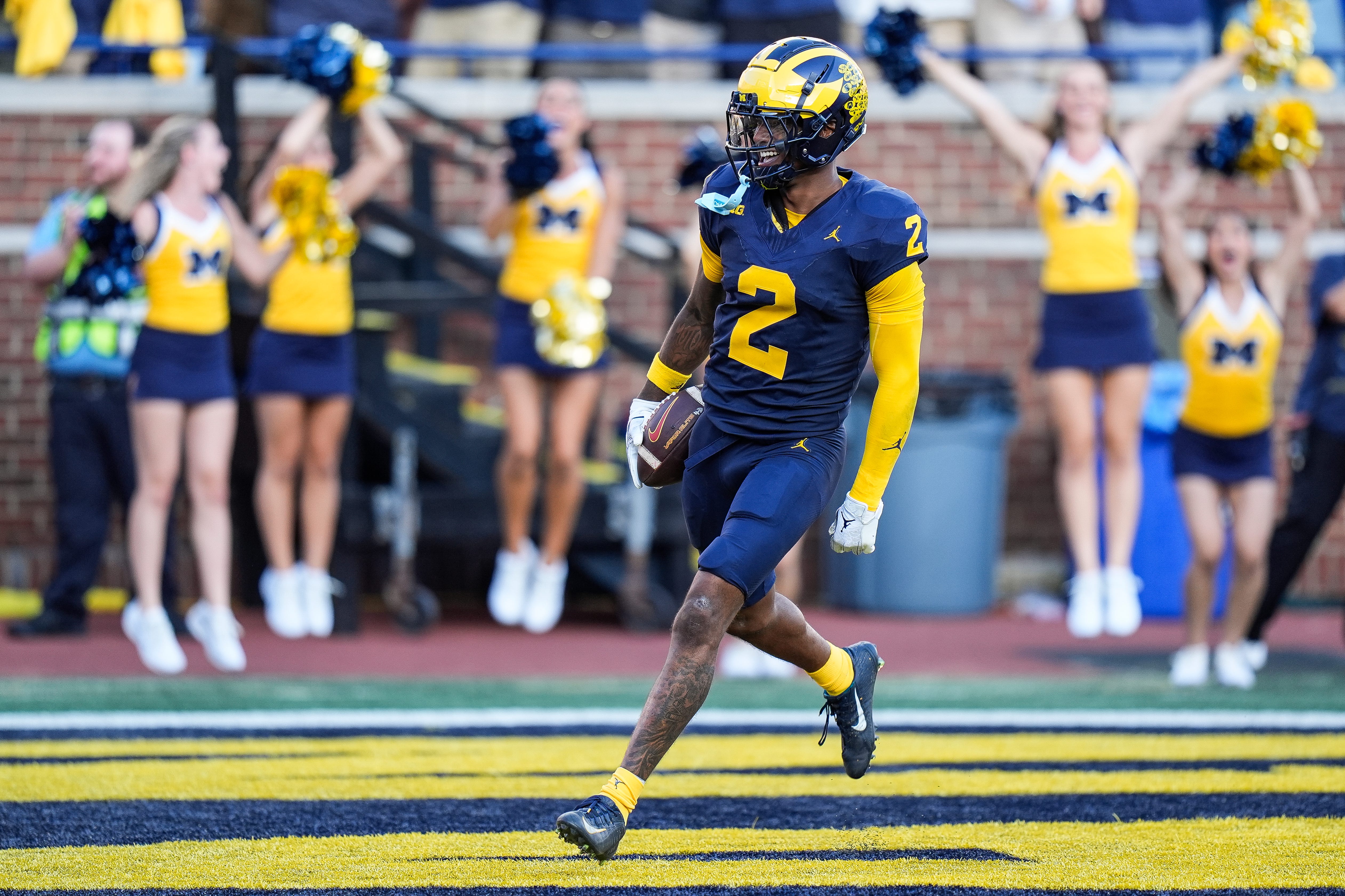 Michigan defensive back Will Johnson celebrates a touchdown after intercepting USC quarterback Miller Moss during the second half at Michigan Stadium in Ann Arbor on Saturday, Sept. 21, 2024.
