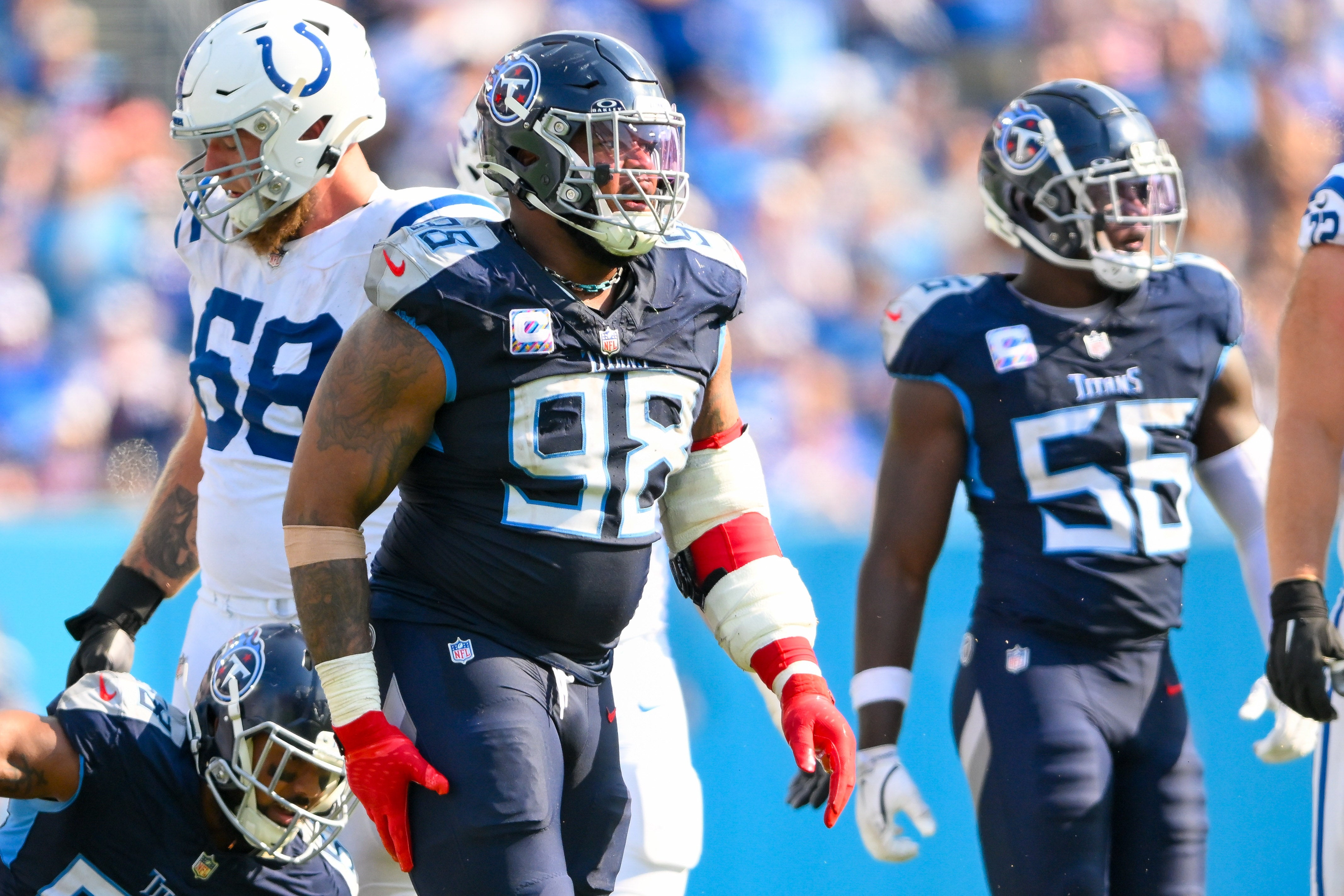 Oct 13, 2024; Nashville, Tennessee, USA; Tennessee Titans defensive tackle Jeffery Simmons (98) celebrates the big tackle by linebacker Harold Landry III (58) against the Indianapolis Colts during the second half at Nissan Stadium.