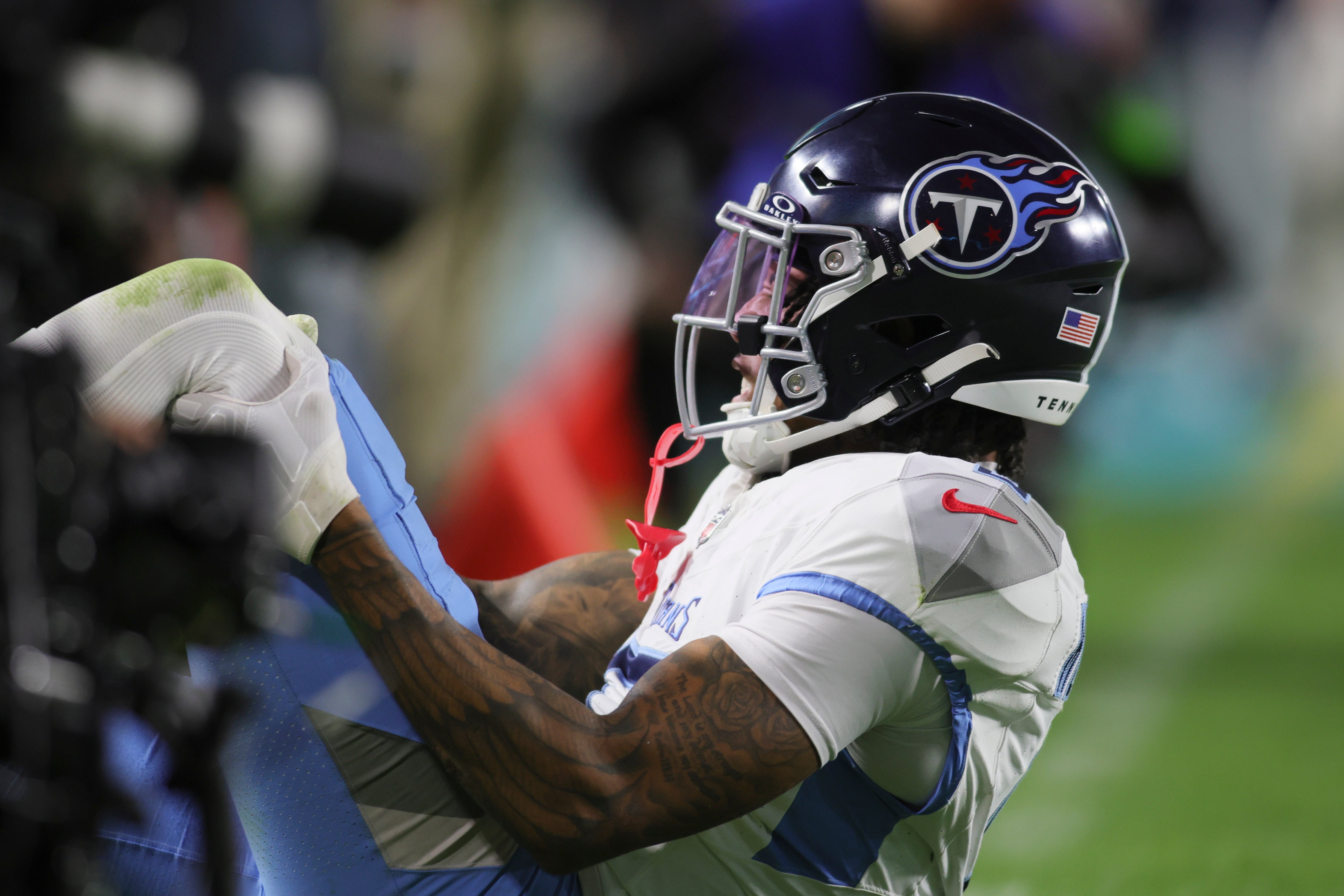 Dec 11, 2023; Miami Gardens, Florida, USA; Tennessee Titans wide receiver DeAndre Hopkins (10) reacts after an apparent leg injury against the Miami Dolphins during the fourth quarter at Hard Rock Stadium.