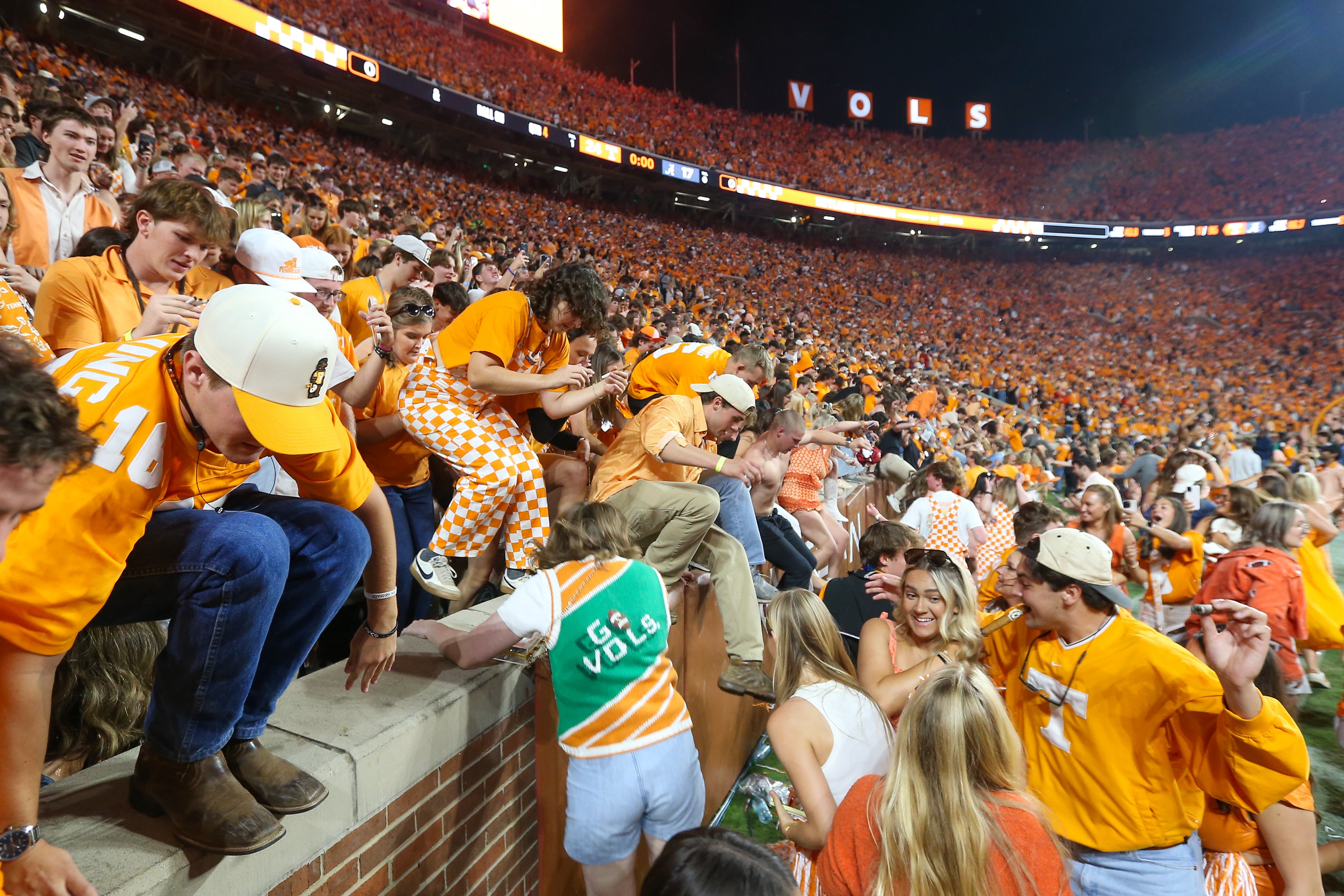 Oct 19, 2024; Knoxville, Tennessee, USA; Tennessee Volunteers fans celebrate after a victory over the Alabama Crimson Tide at Neyland Stadium.