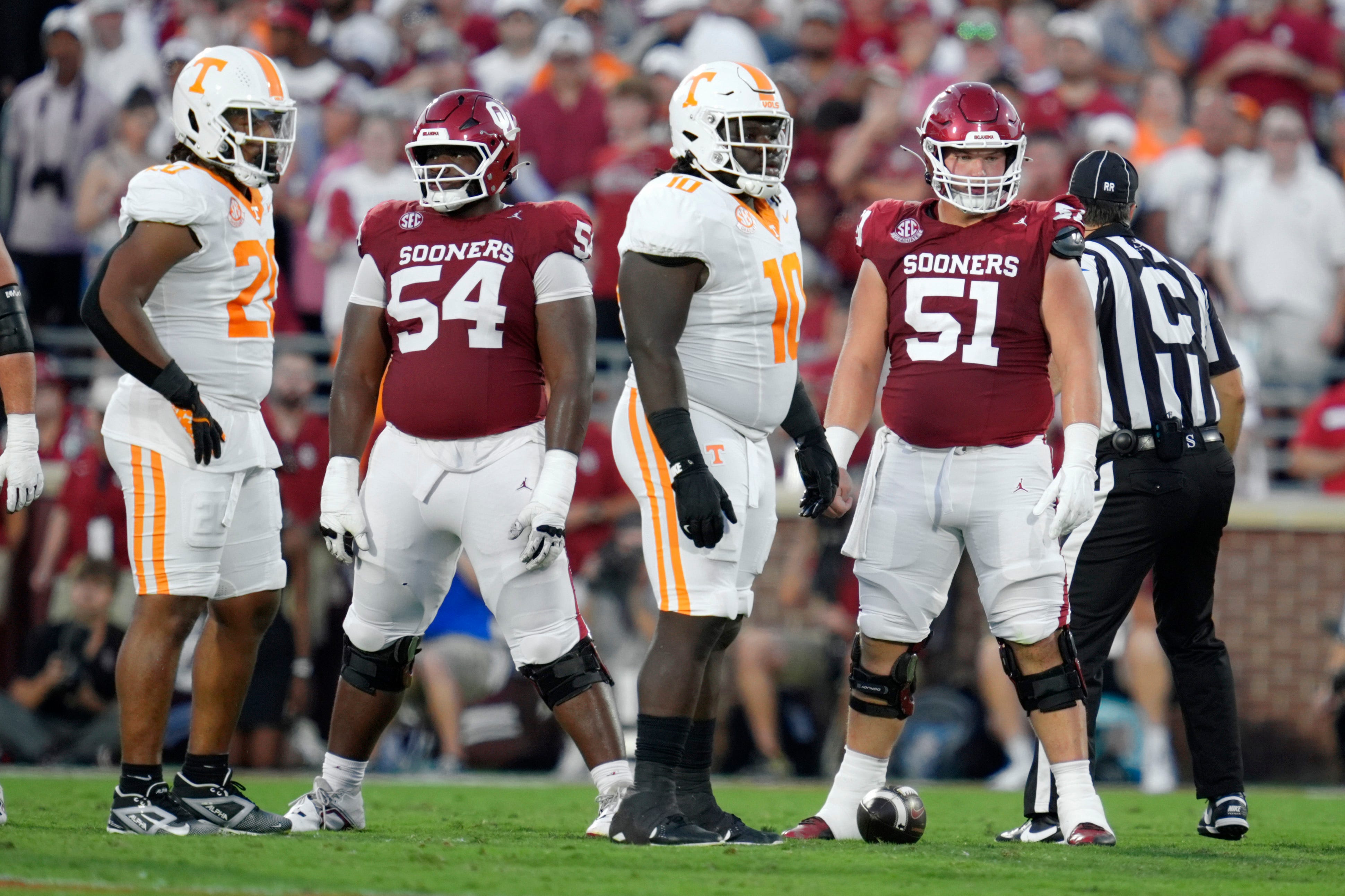 Oklahoma Sooners offensive lineman Branson Hickman (51) and offensive lineman Febechi Nwaiwu (54) walk to the line before a play during a college football game between the University of Oklahoma Sooners (OU) and the Tennessee Volunteers at Gaylord Family - Oklahoma Memorial Stadium in Norman, Okla., Saturday, Sept. 21, 2024.