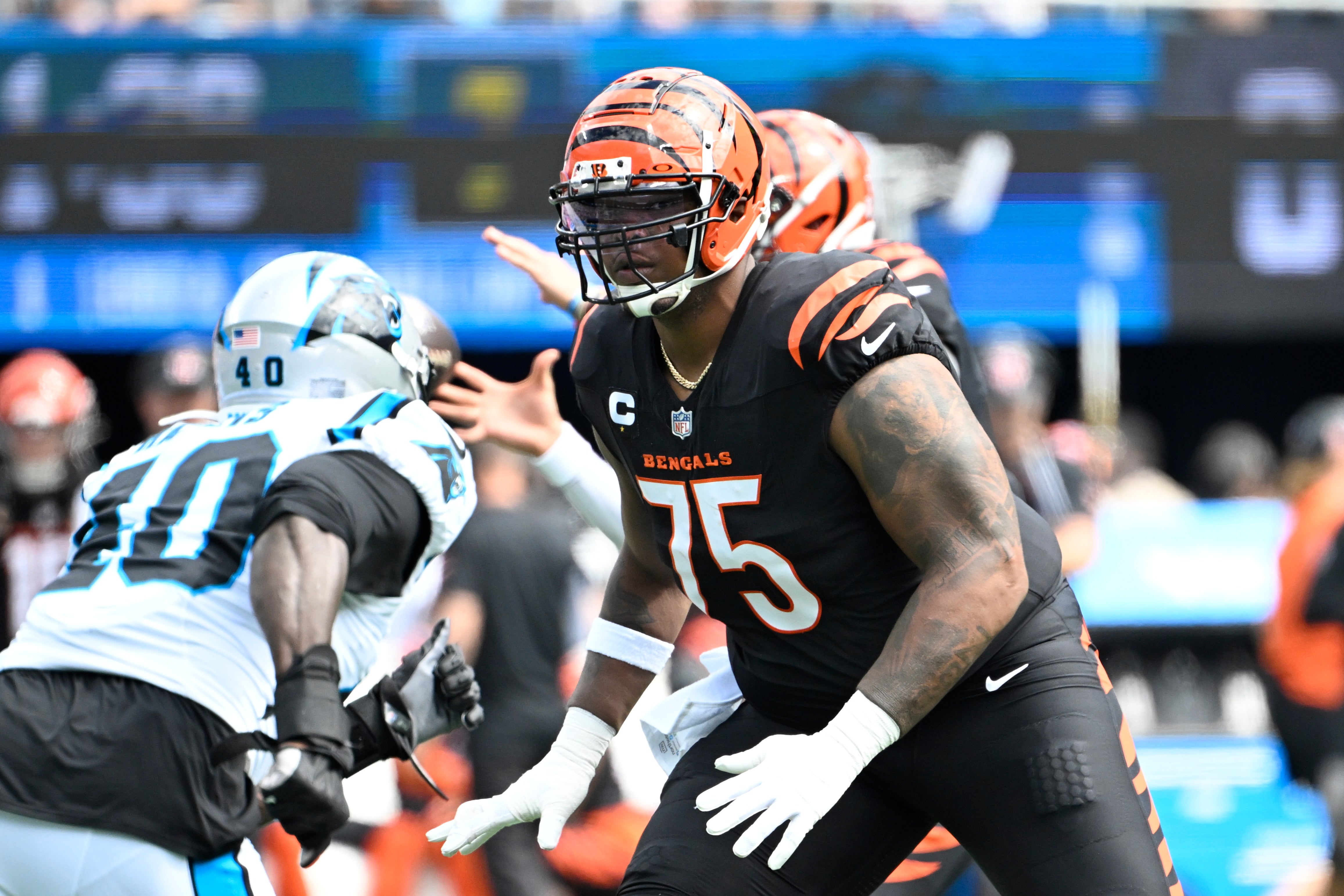 Sep 29, 2024; Charlotte, North Carolina, USA; Cincinnati Bengals offensive tackle Orlando Brown Jr. (75) blocks as Carolina Panthers linebacker Charles Harris (40) rushes in the first quarter at Bank of America Stadium.