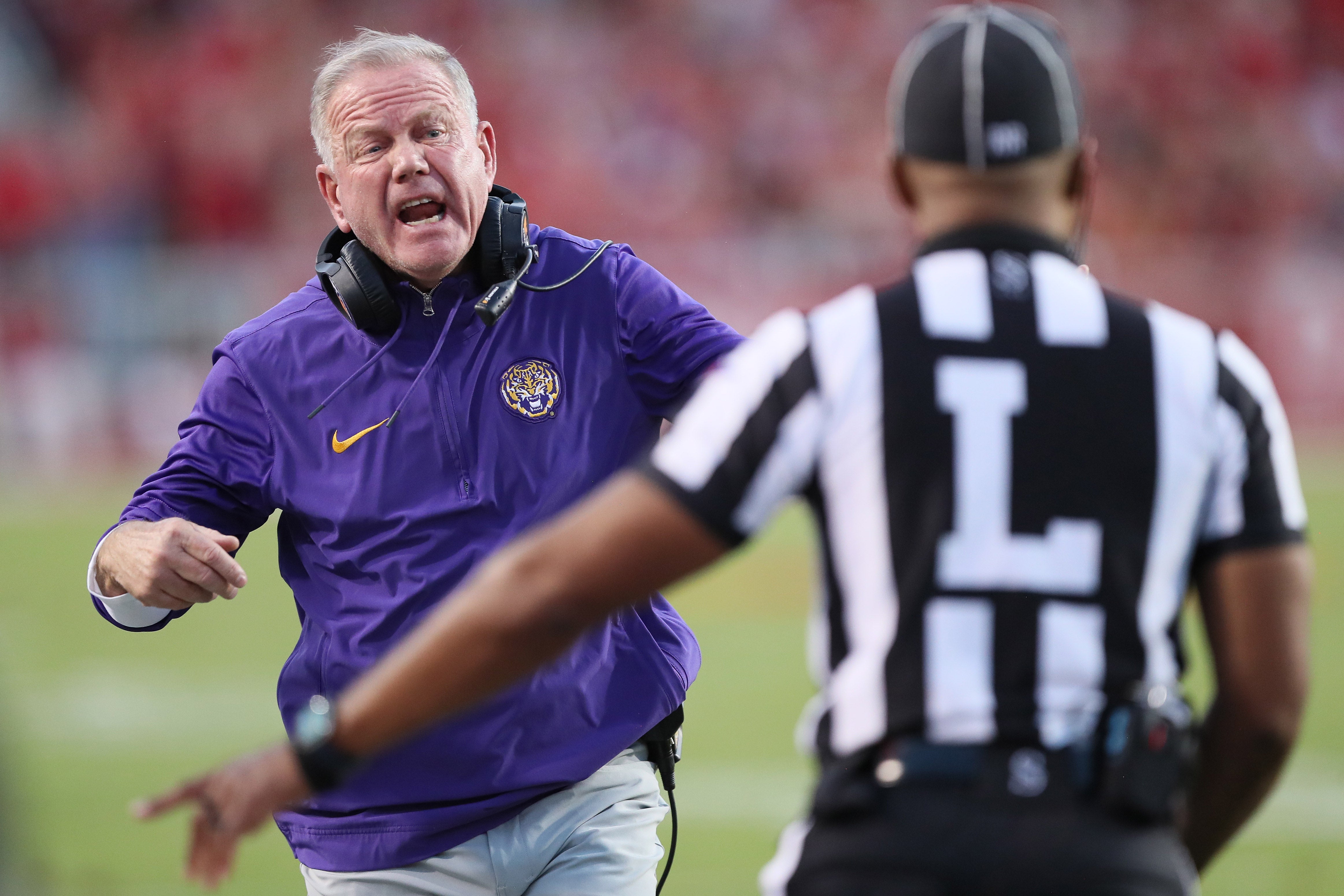 LSU Tigers head coach Brian Kelly reacts to a call in the first half against the Arkansas Razorbacks at Donald W. Reynolds Razorback Stadium.