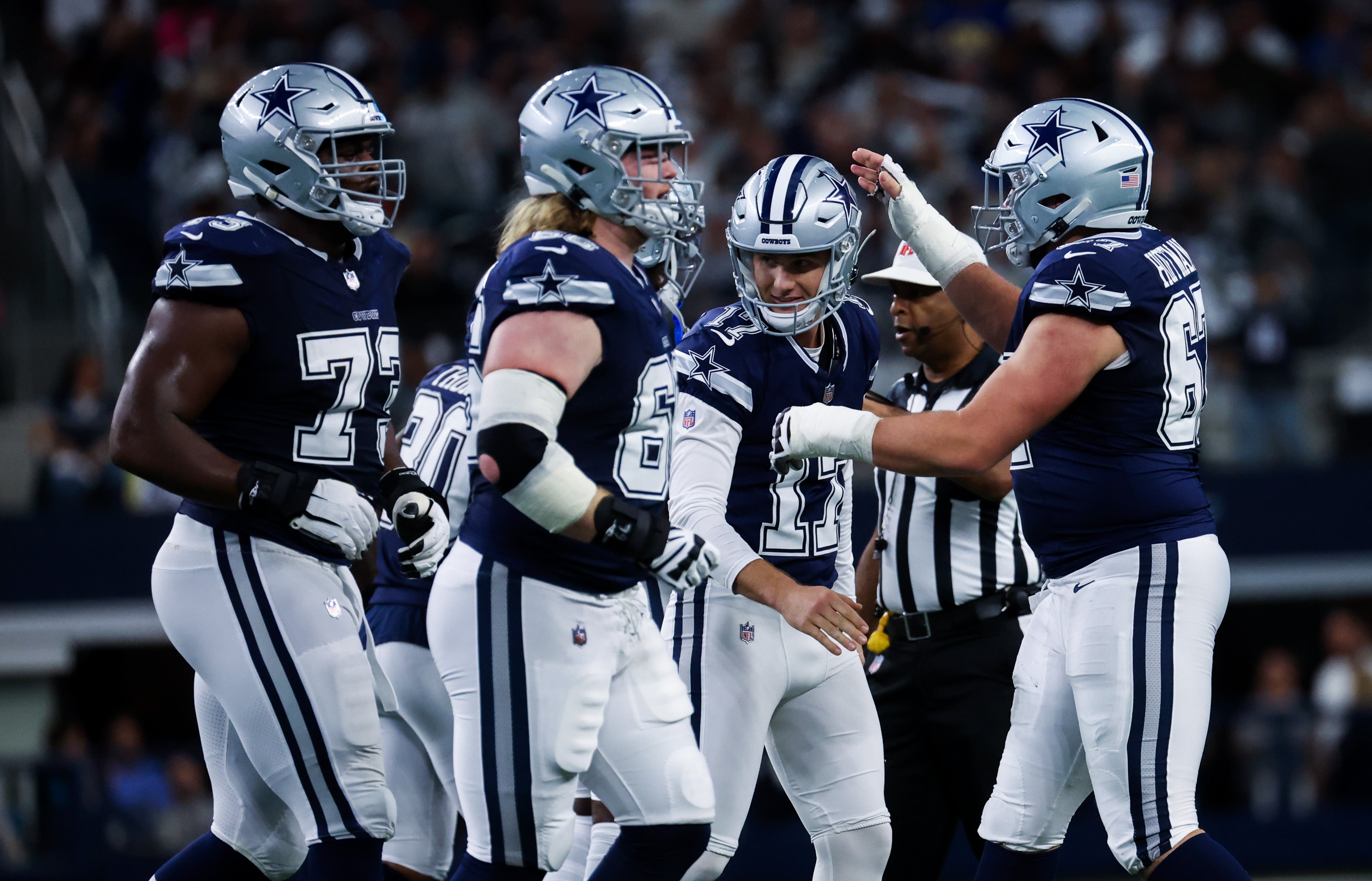 Dallas Cowboys place kicker Brandon Aubrey (17) celebrates with teammates after kicking a field goal during the first quarter against the Los Angeles Rams at AT&T Stadium.