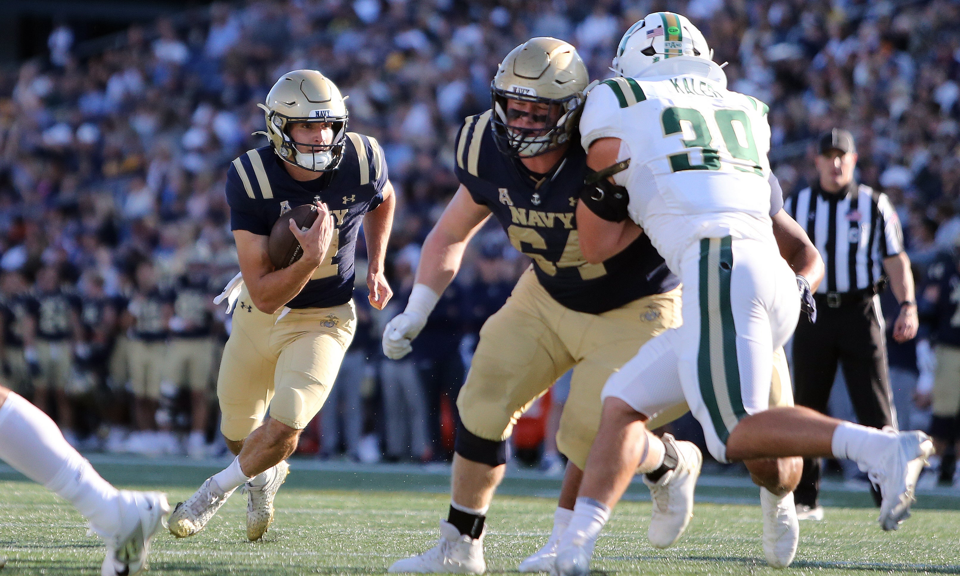 Navy Midshipmen quarterback Blake Horvath (11) runs for a gain against the Charlotte 49ers during the first half at Navy-Marine Corps Memorial Stadium.