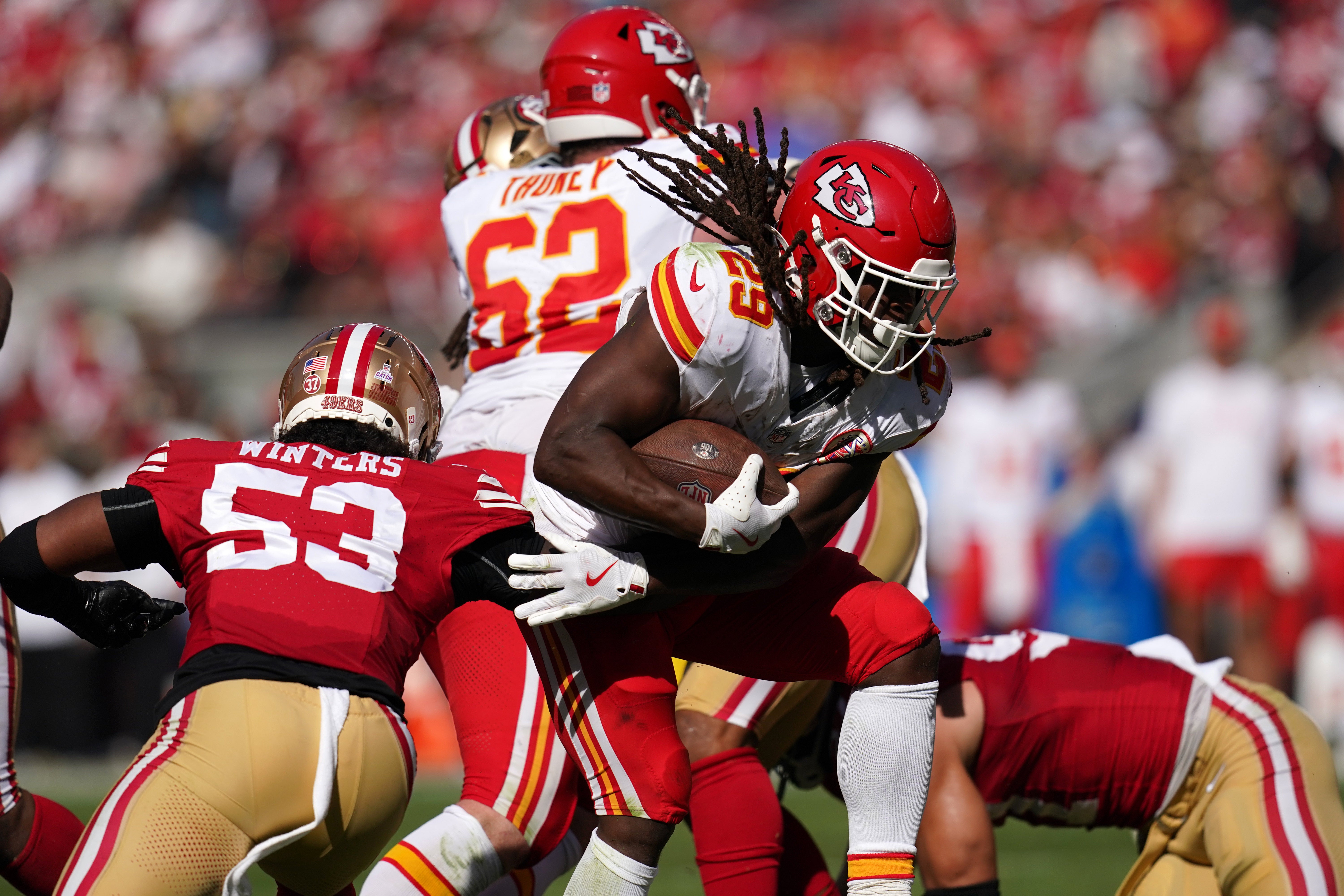 Oct 20, 2024; Santa Clara, California, USA; Kansas City Chiefs running back Kareem Hunt (29) scores a touchdown in front of San Francisco 49ers linebacker Dee Winters (53) in the second quarter at Levi's Stadium.