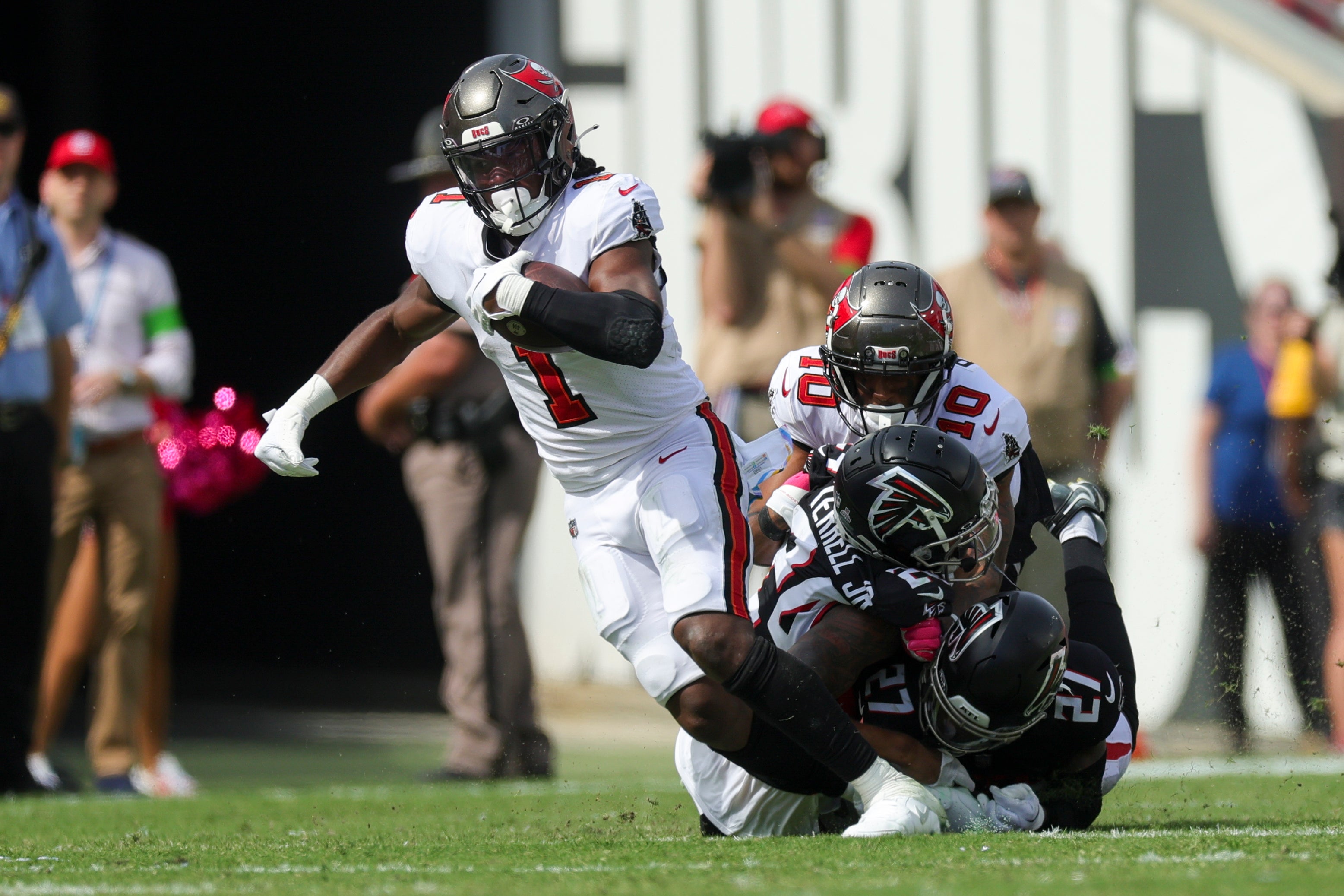 Oct 22, 2023; Tampa, Florida, USA; Tampa Bay Buccaneers running back Rachaad White (1) breaks free from Atlanta Falcons safety Richie Grant (27) in the third quarter at Raymond James Stadium.