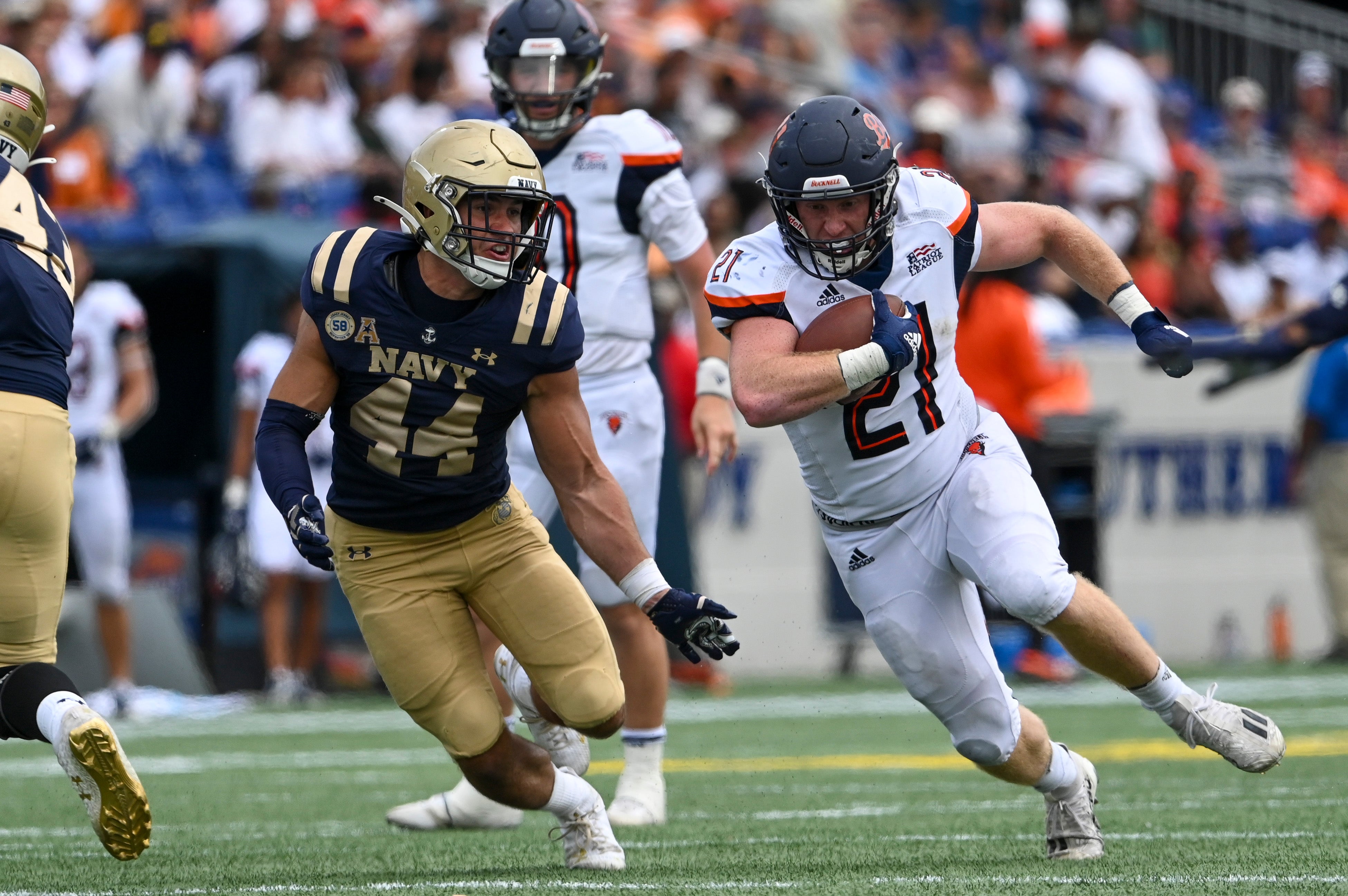 Bucknell Bison running back Paul Neel (21) rushes passed Navy Midshipmen linebacker Colin Ramos (44) during the second half at Navy-Marine Corps Memorial Stadium.
