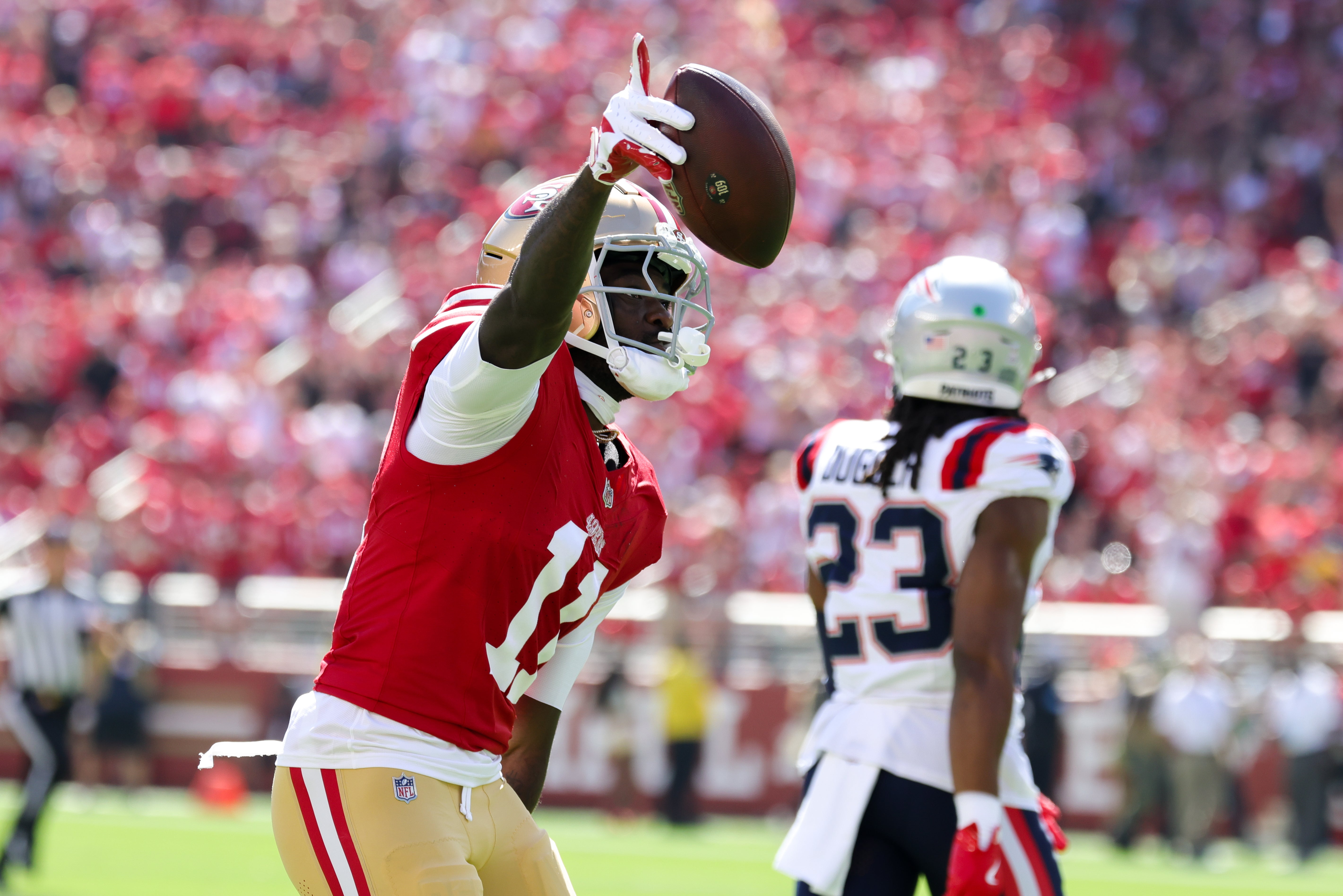 San Francisco 49ers wide receiver Brandon Aiyuk (11) celebrates after a catch against the New England Patriots during the first quarter at Levi's Stadium.