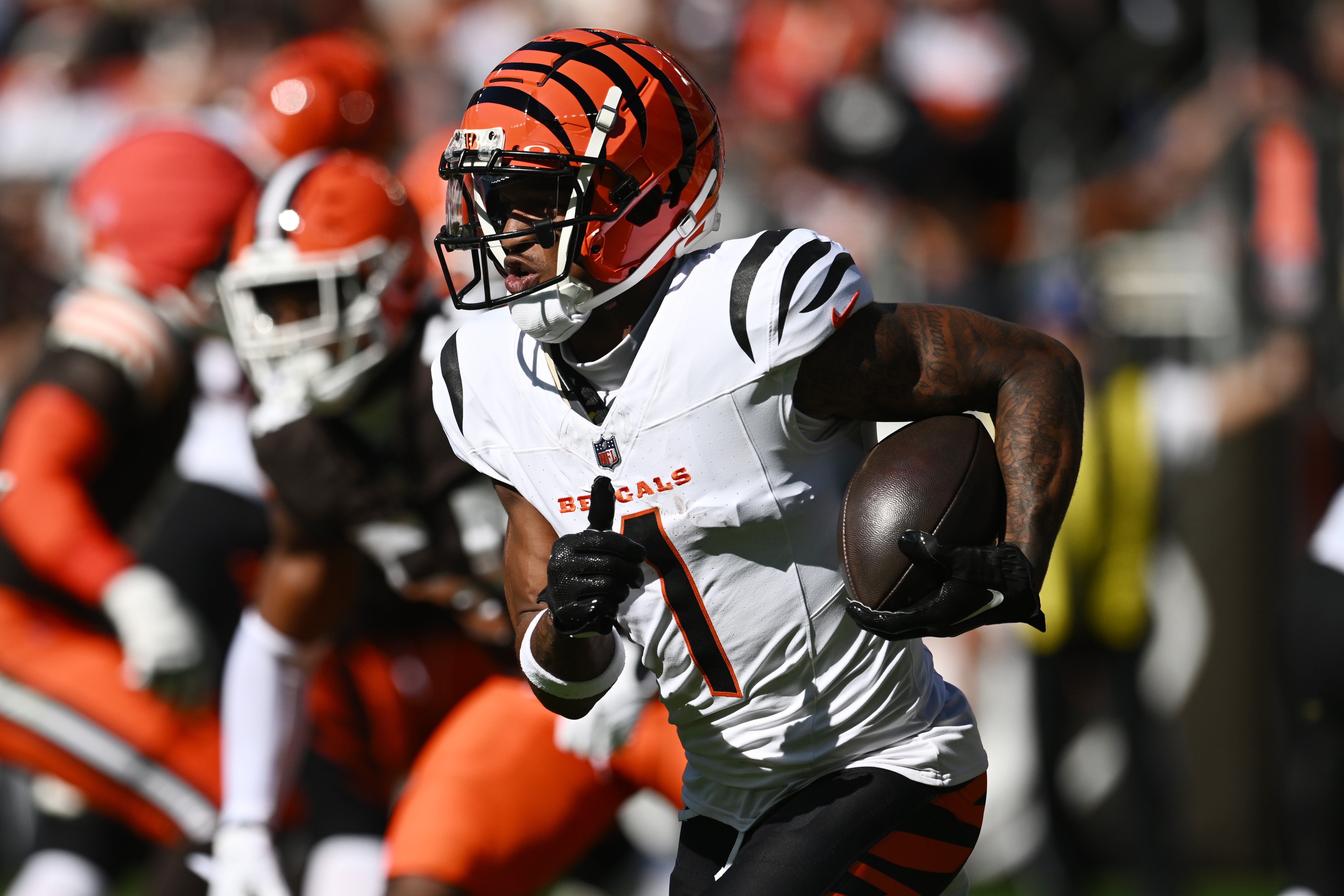 Oct 20, 2024; Cleveland, Ohio, USA; Cincinnati Bengals wide receiver Ja'Marr Chase (1) runs with the ball during the first quarter against the Cleveland Browns at Huntington Bank Field.