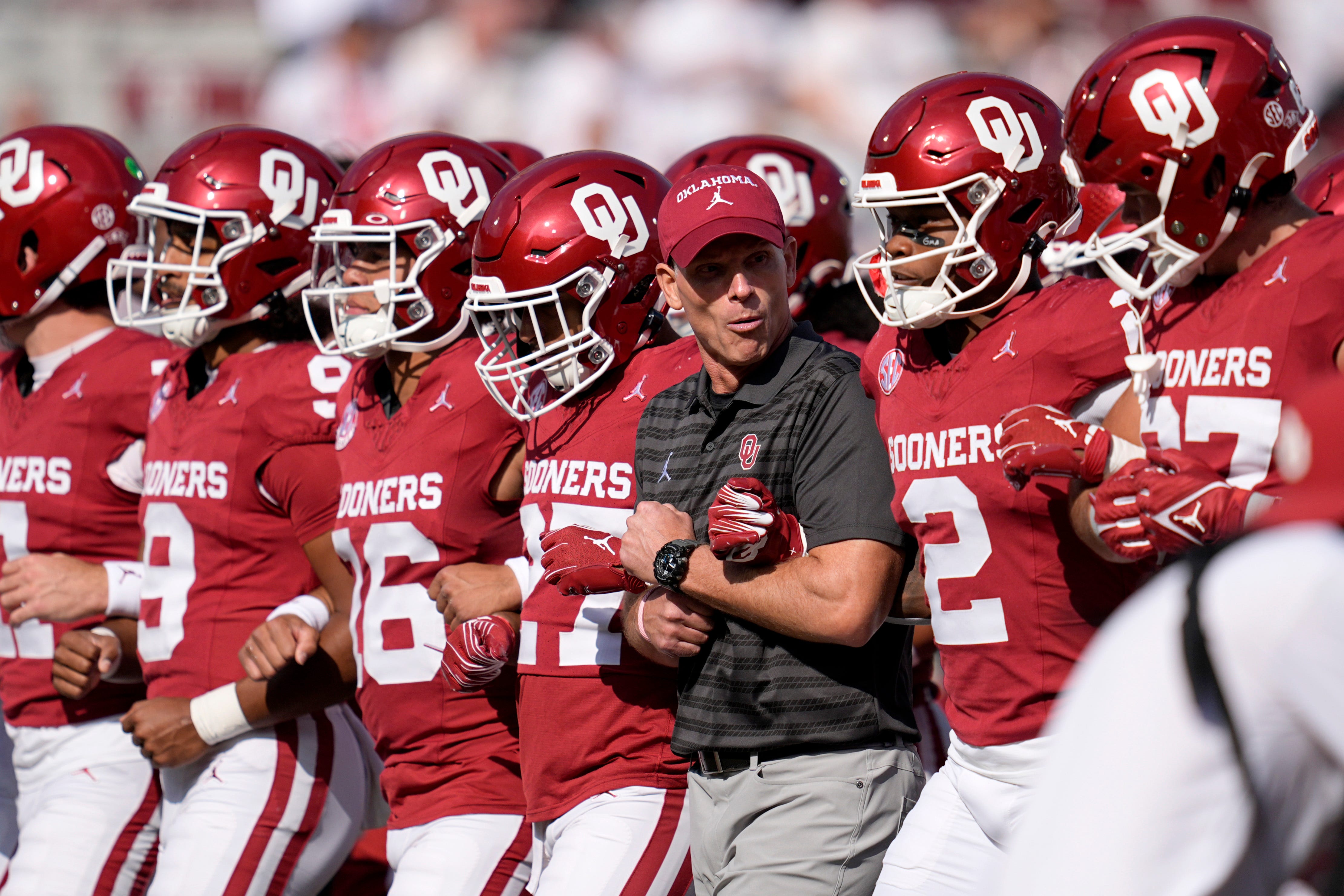Oklahoma coach Brent Venables locks arms with players before a college football game between the University of Oklahoma Sooners (OU) and the South Carolina Gamecocks at Gaylord Family - Oklahoma Memorial Stadium in Norman, Okla., Saturday, Oct. 19, 2024.