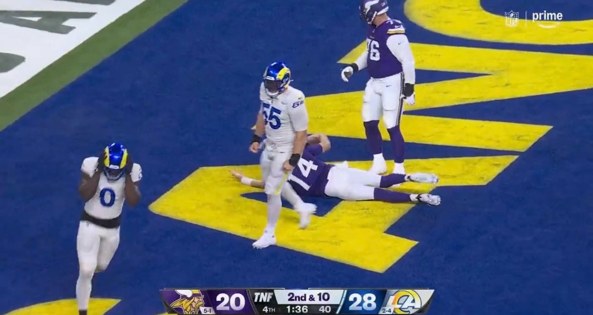 Edge rusher Byron Young (0) reacts to committing a facemask penalty on quarterback Sam Darnold (14) and the referees don't make the call.