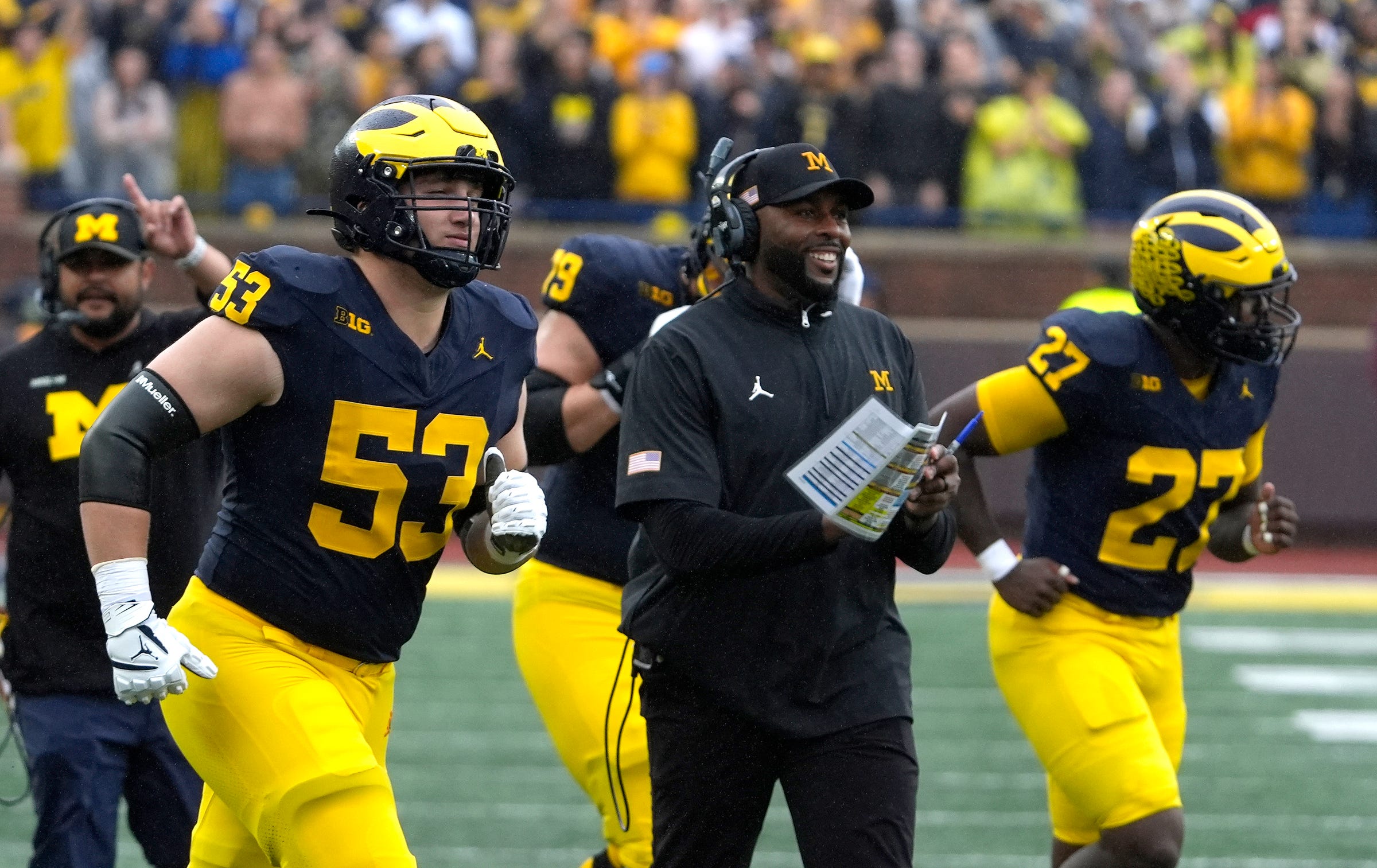 Michigan football coach Sherrone Moore celebrates a play during first-half action between Michigan and Minnesota at Michigan Stadium in Ann Arbor on Saturday, Sept. 28, 2024.