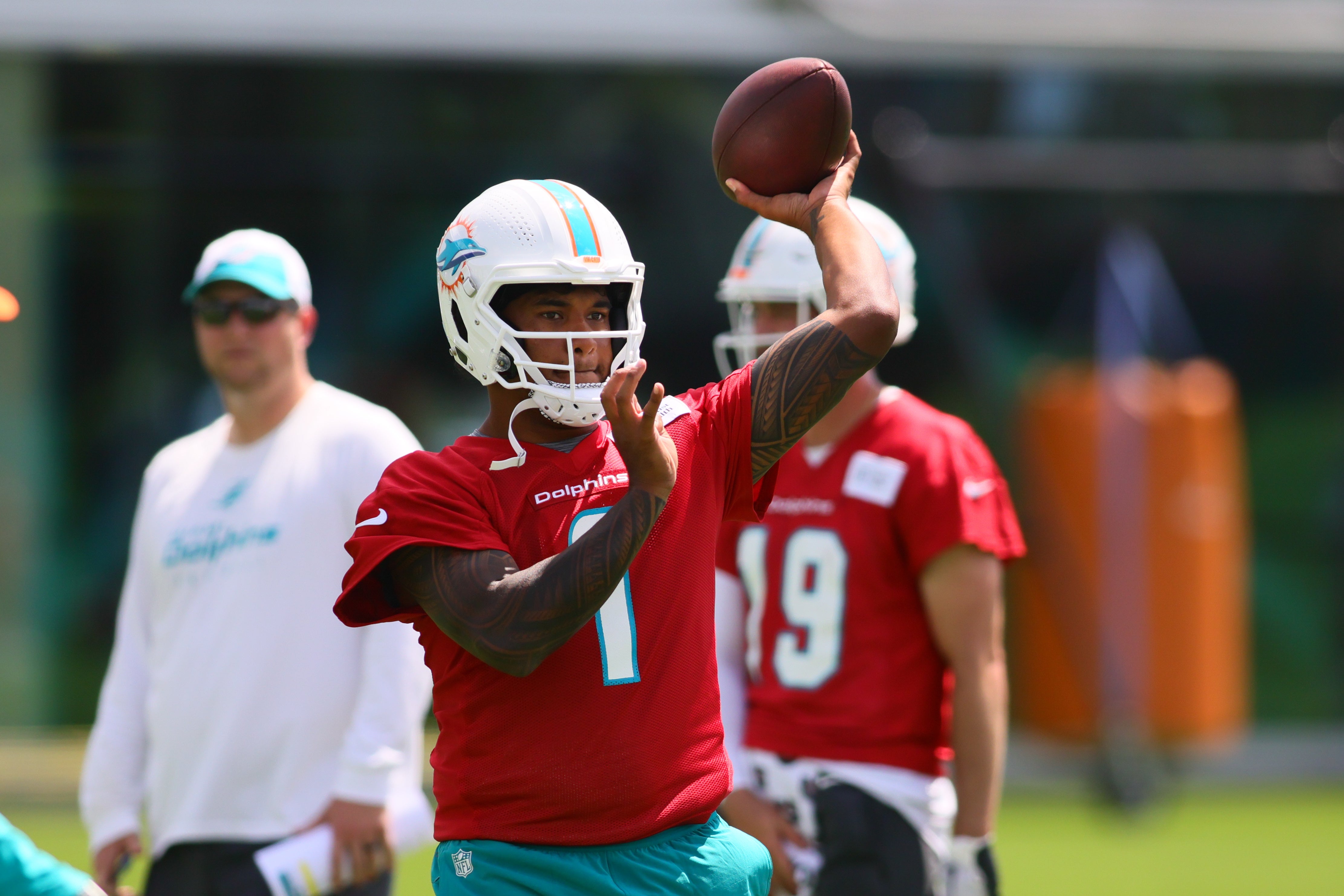 Jun 4, 2024; Miami Gardens, FL, USA; Miami Dolphins quarterback Tua Tagovailoa (1) throws the football during mandatory minicamp at Baptist Health Training Complex.