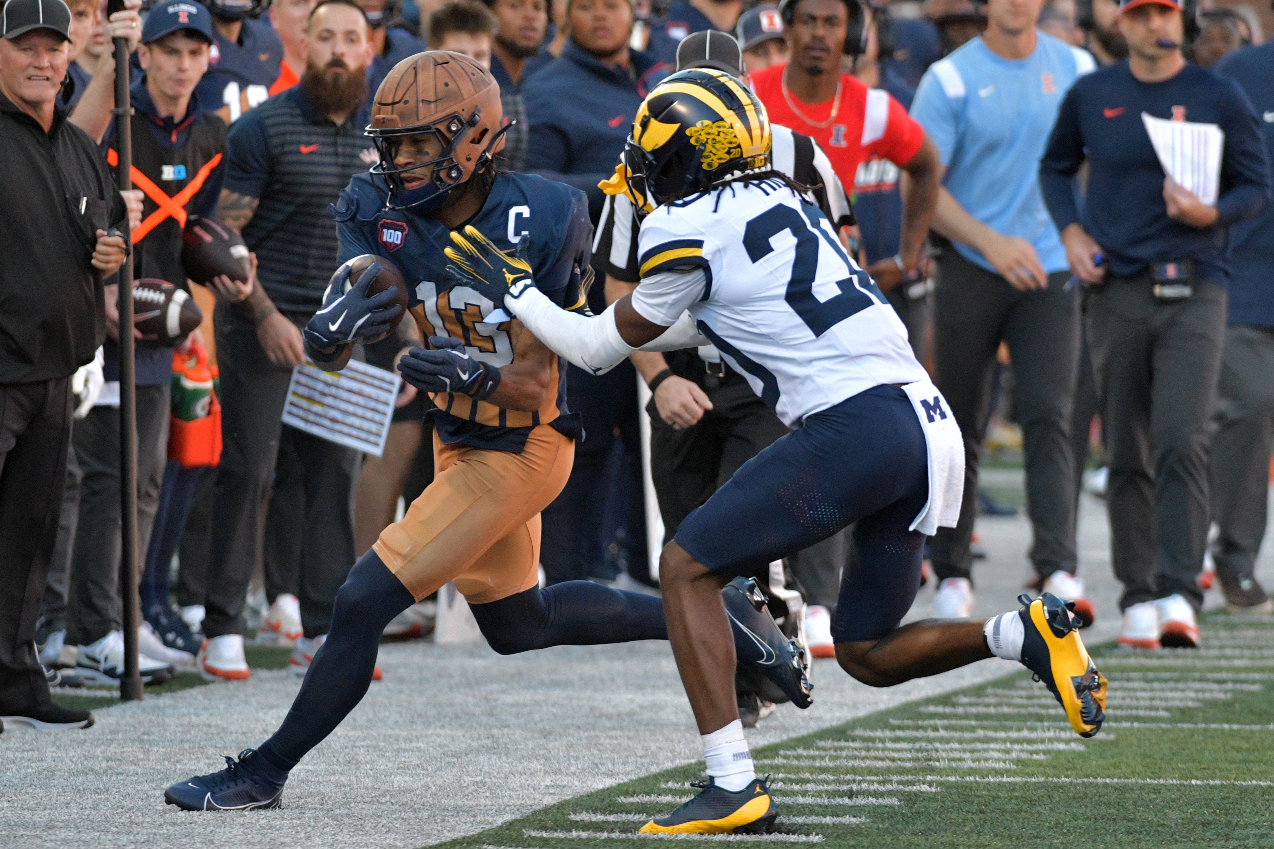 Oct 19, 2024; Champaign, Illinois, USA; Illinois Fighting Illini wide receiver Pat Bryant (13) runs to the sidelines against the Michigan Wolverines during the first half at Memorial Stadium.