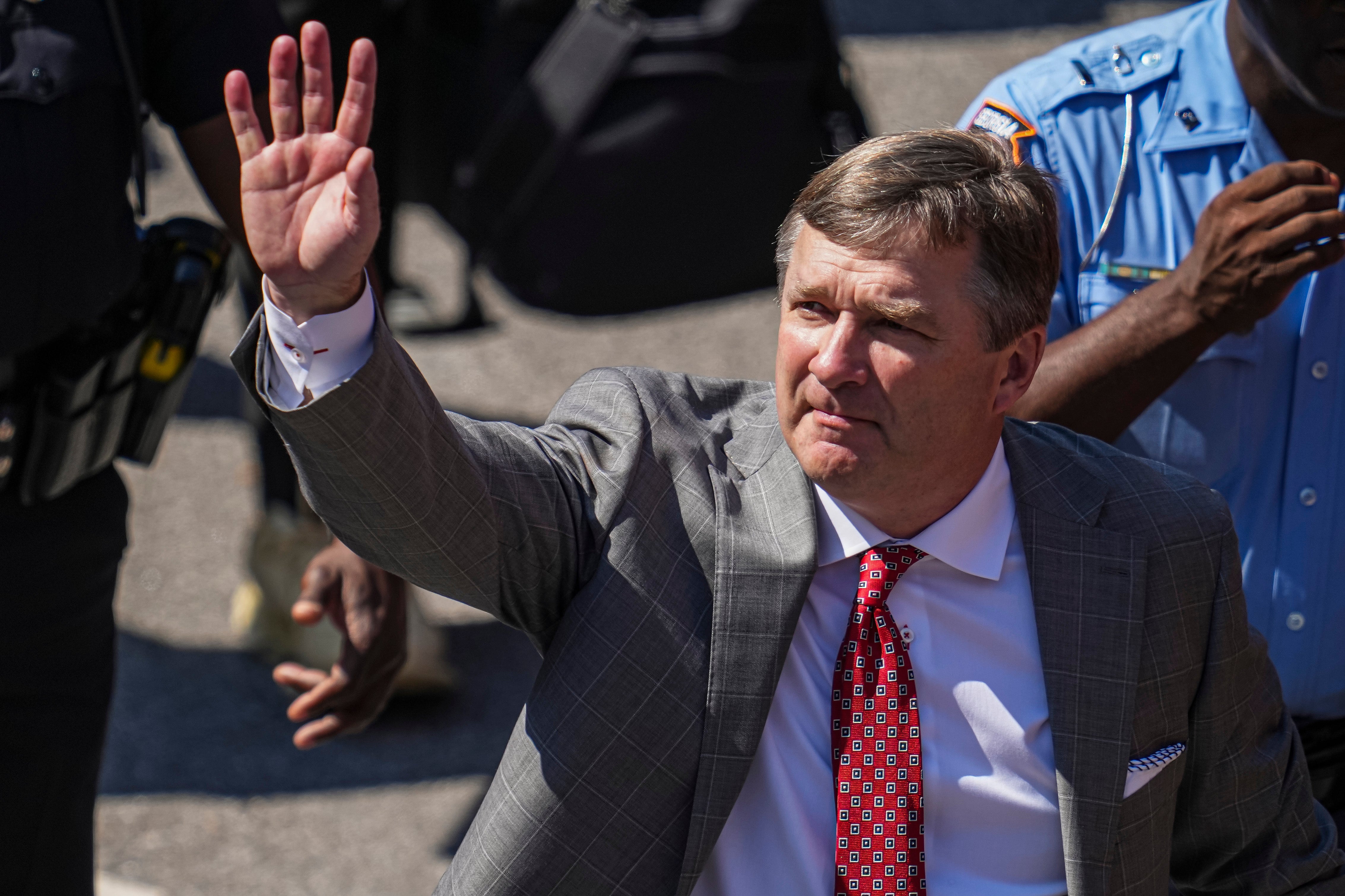 Oct 5, 2024; Athens, Georgia, USA; Georgia Bulldogs head coach Kirby Smart reacts to fans during the dawg walk before the game against the Auburn Tigers at Sanford Stadium.